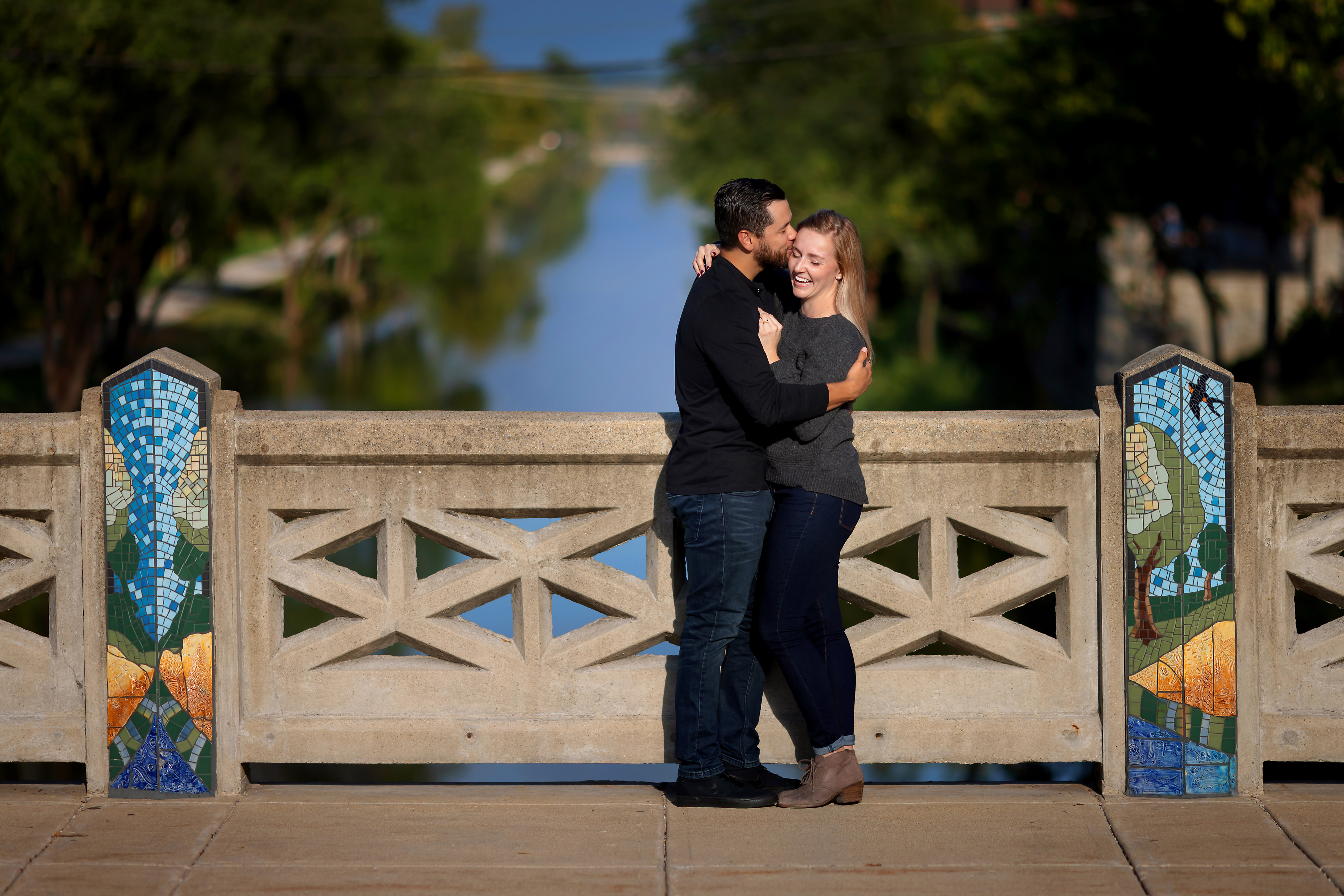 Couple poses for engagement photos in downtown Lemont Illinois