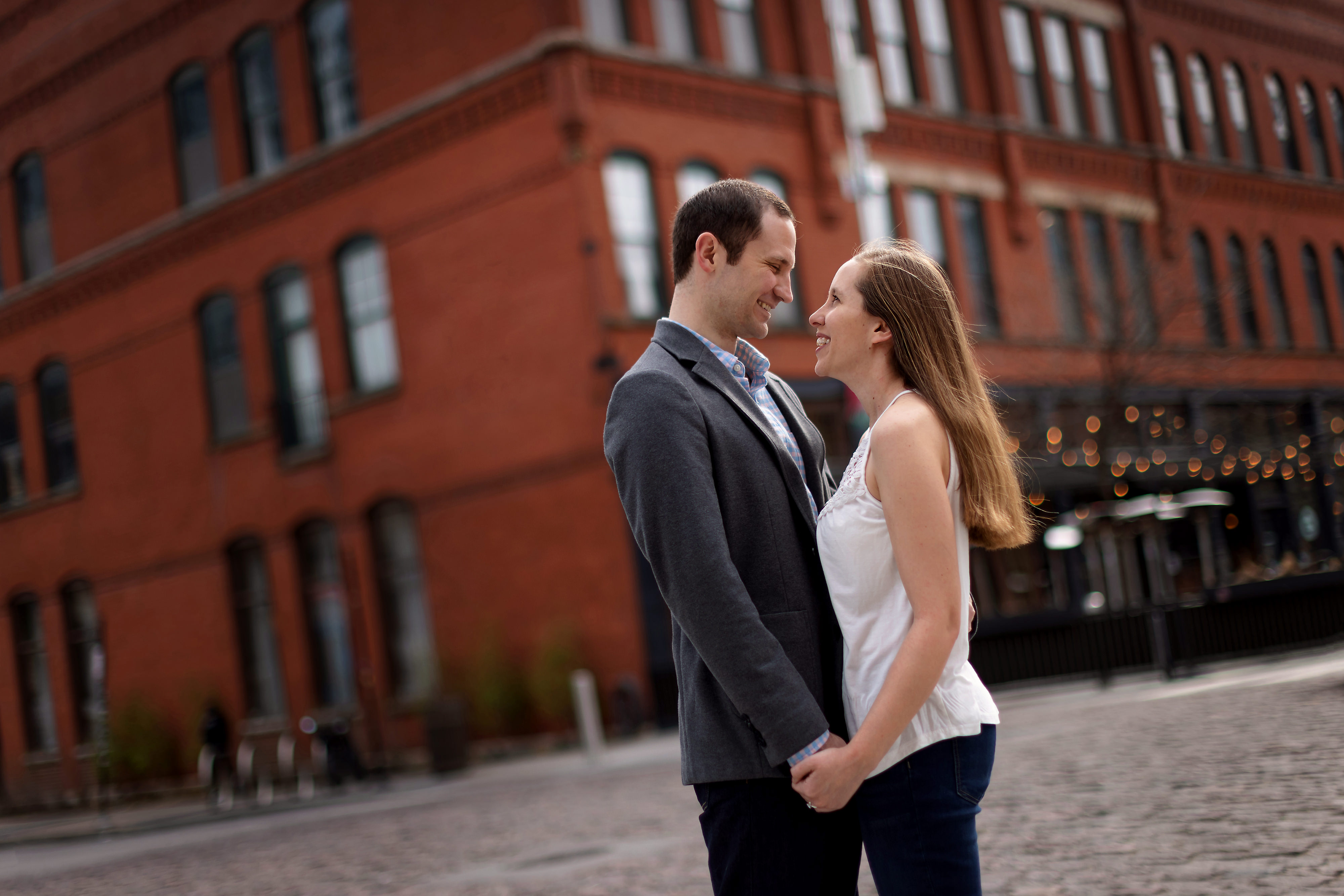 Wedding couple poses for engagement photos in Chicago's West Loop neighborhood