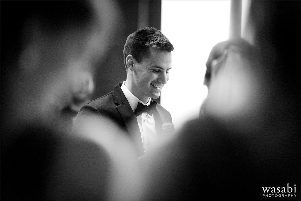 black and white groom smile