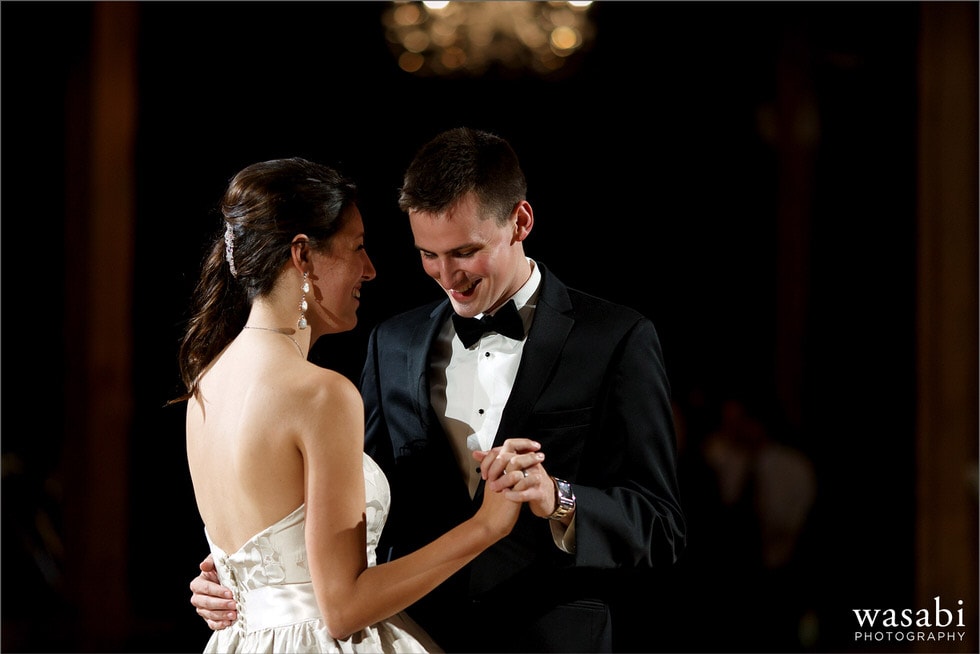 closeup of bride and groom holding hands during first dance