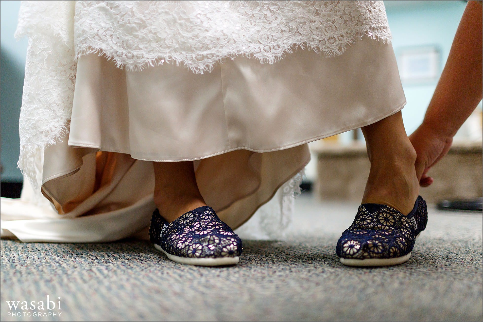 bride putting on shoes