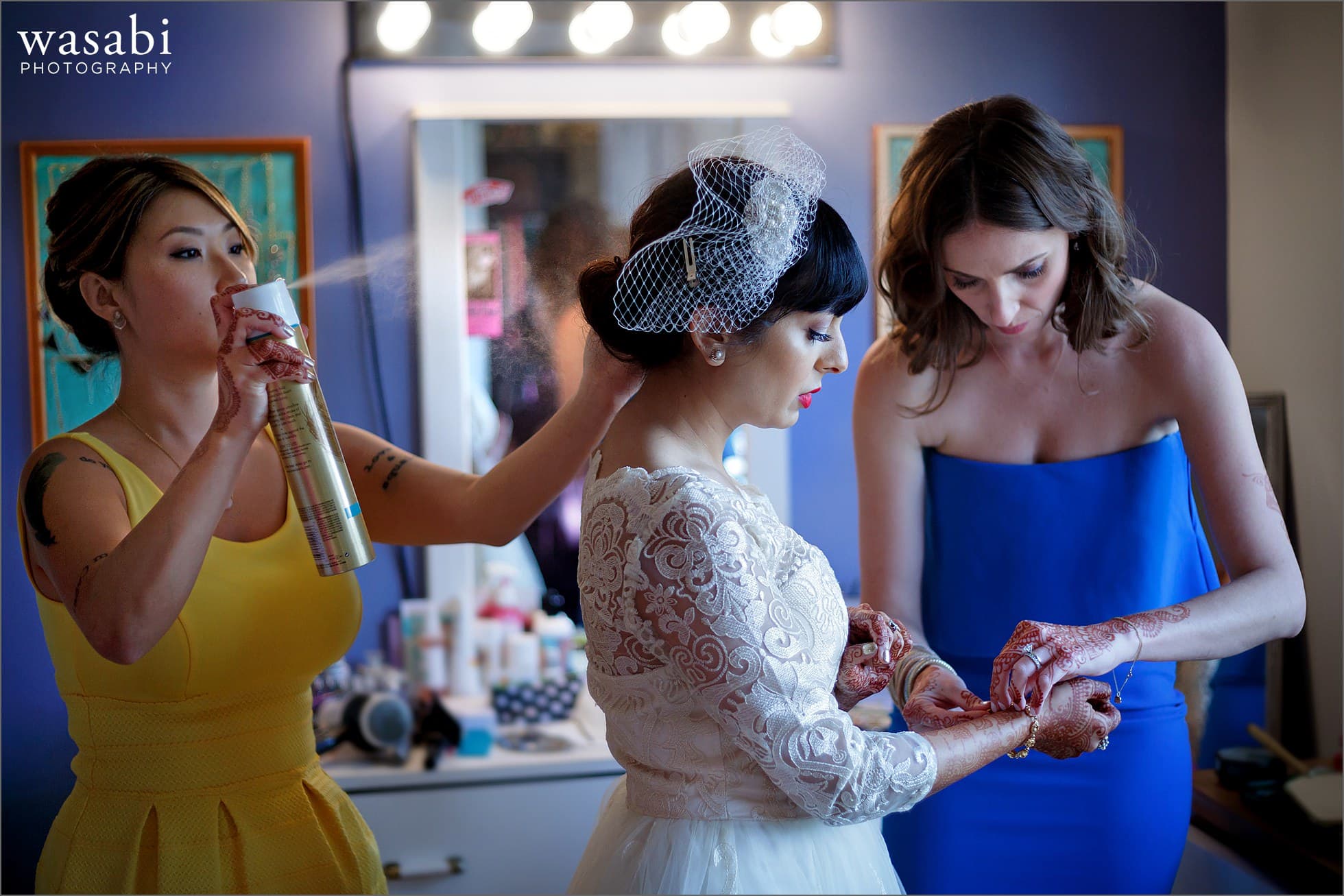 bridesmaids helping bride get ready