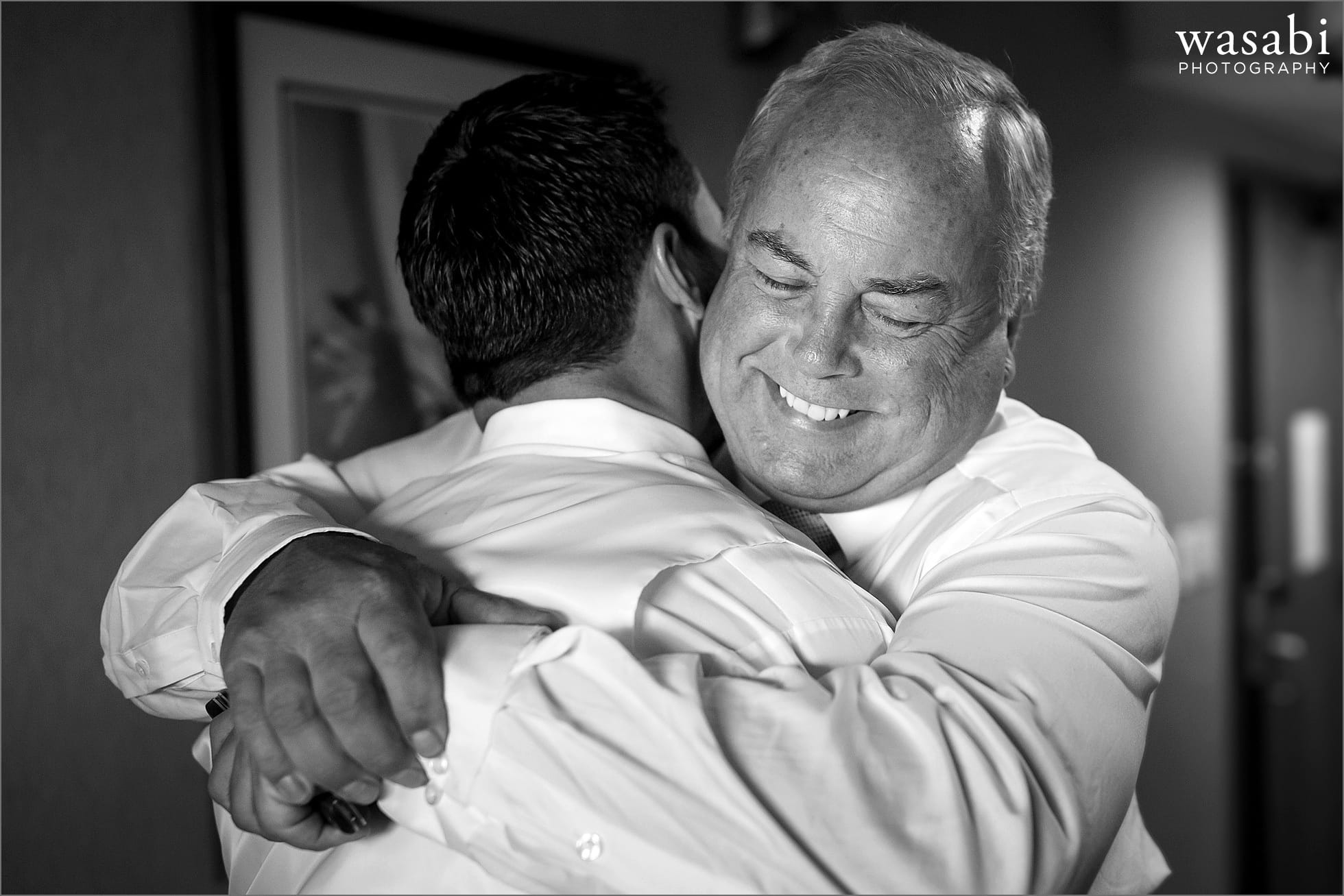 groom hugging father