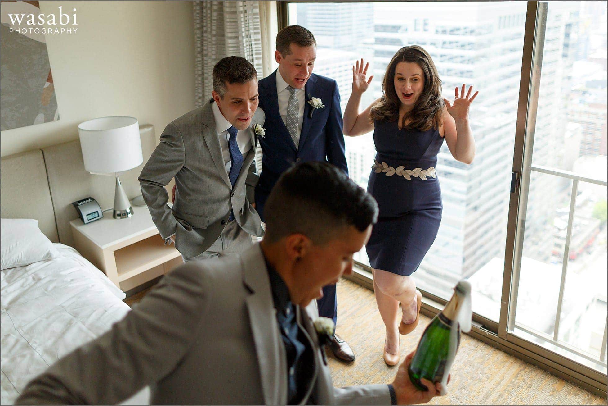 wedding party champagne toast while grooms get ready at marriott magnificent mile in Chicago