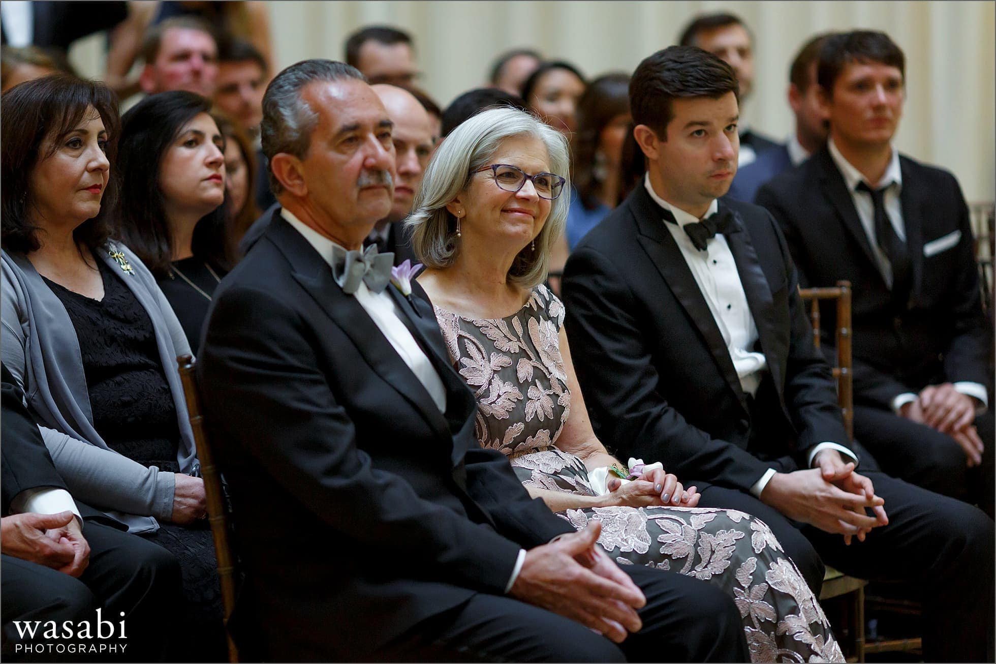 parents watch wedding ceremony at The Rookery Building in Chicago