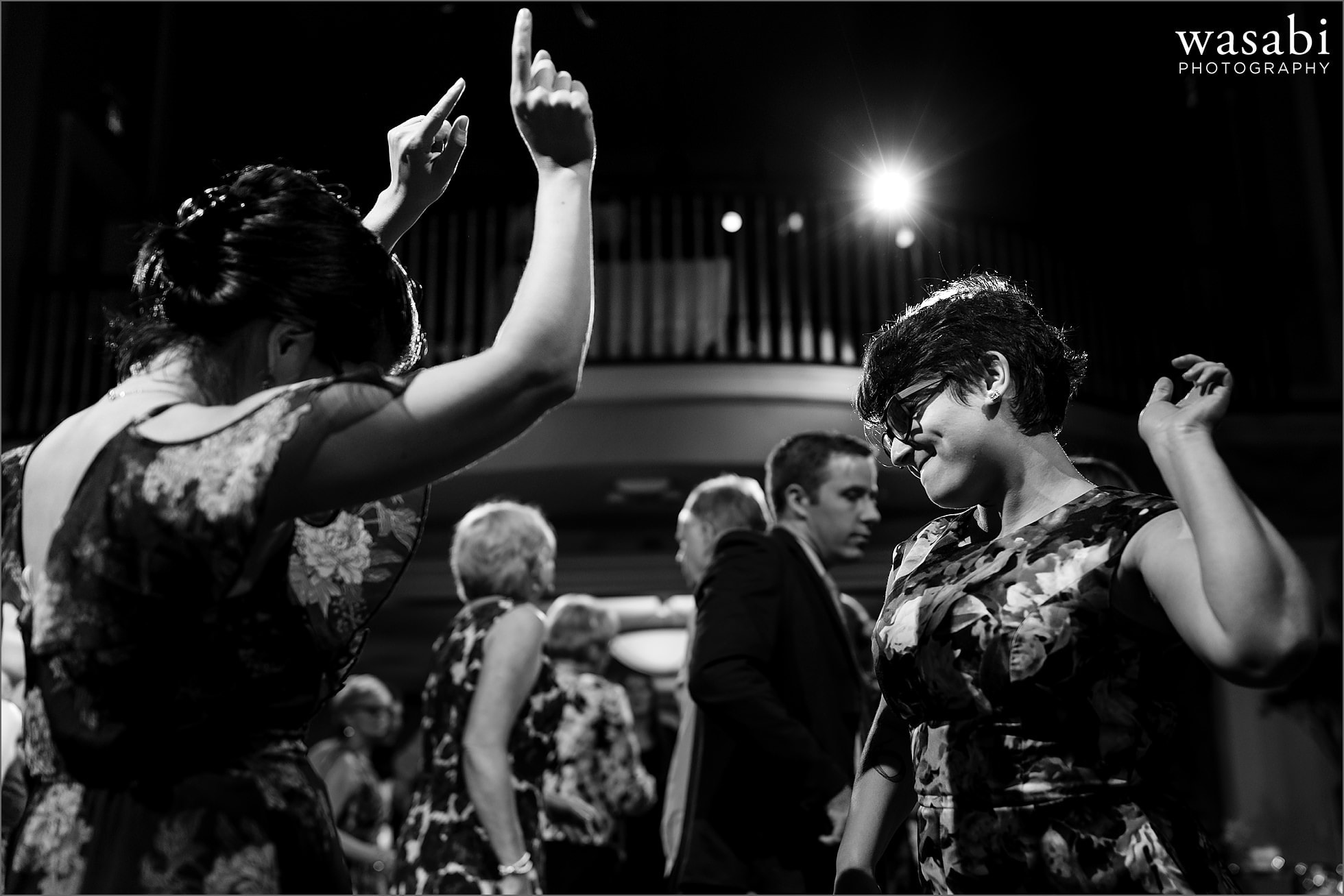 black and white women dance during Oakhurst Country Club wedding reception photos