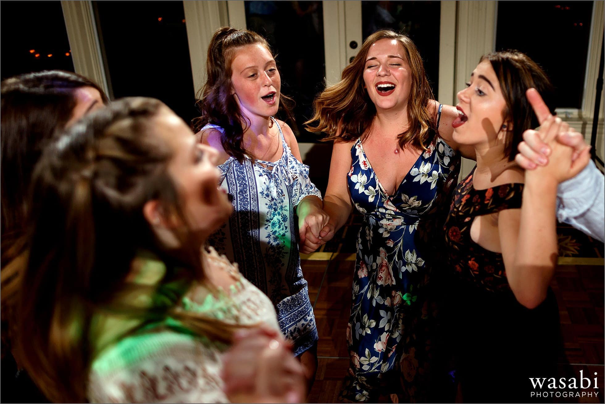 girls dance during wedding reception at Oakhurst Country Club in Clarkston, Michigan