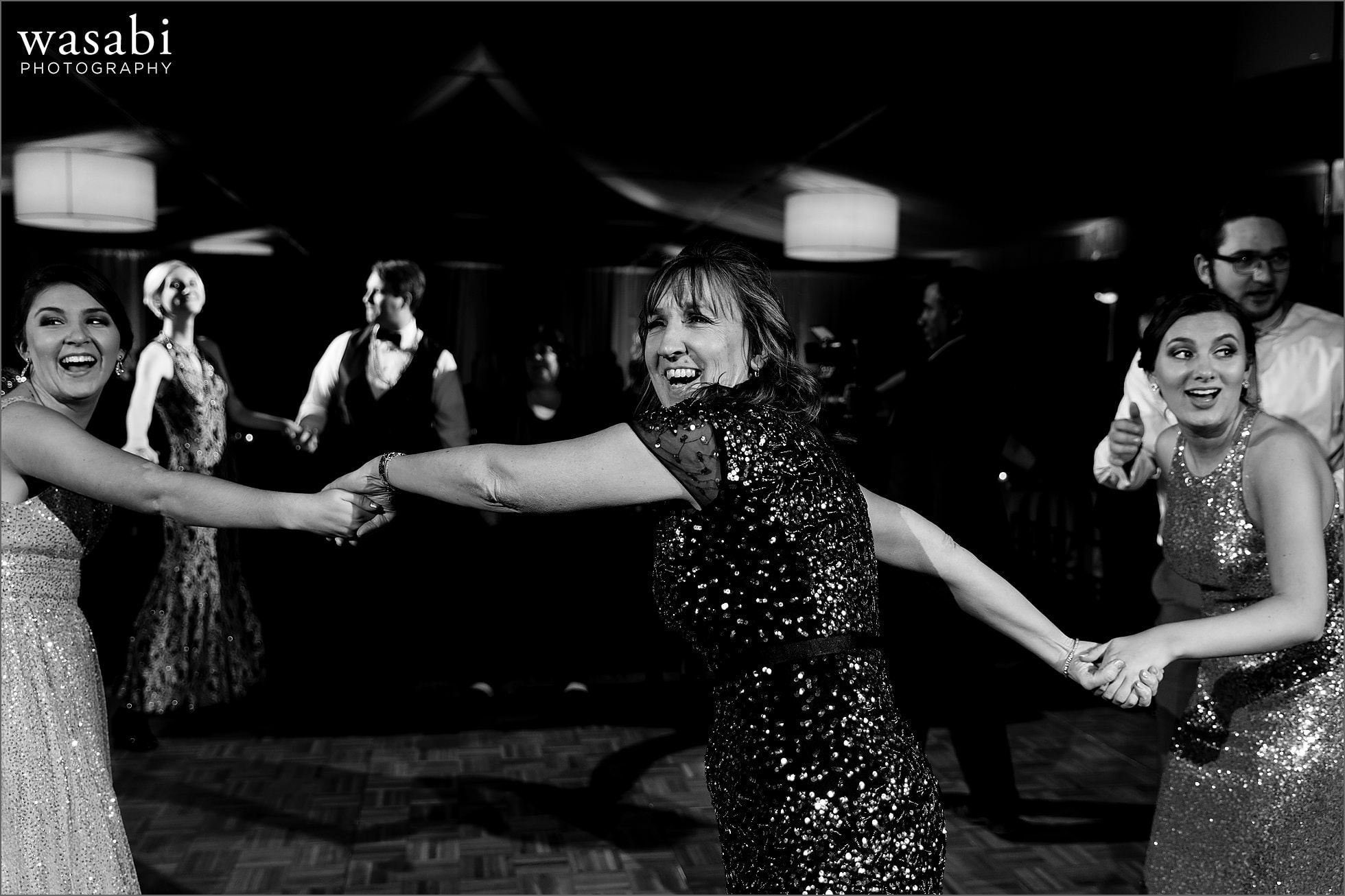 wedding guests dancing during New Years Eve wedding reception at Chicago Marriott Lincolnshire Resort