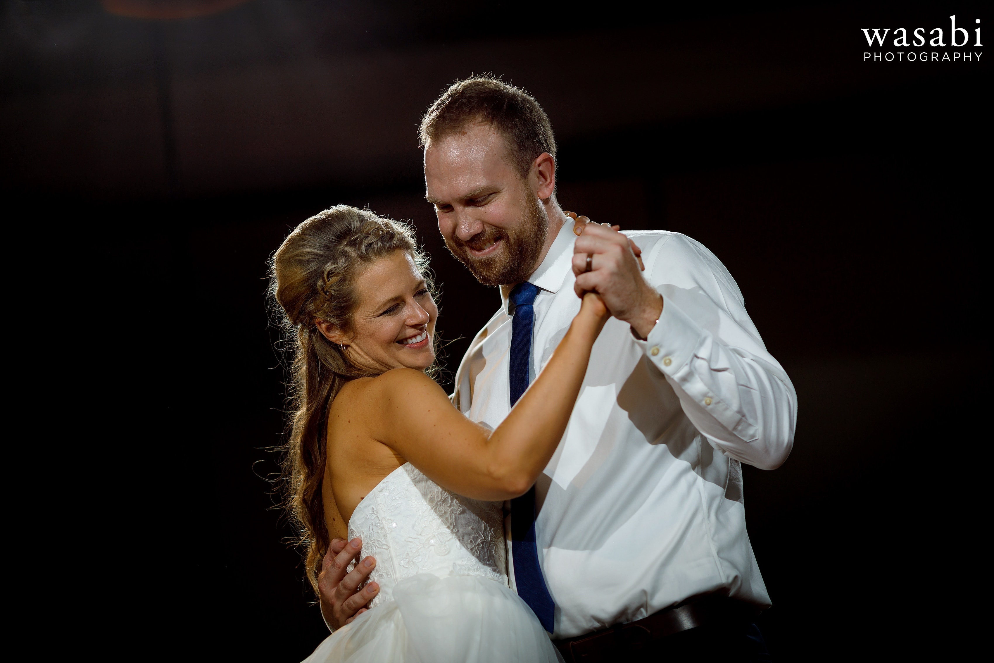 bride and groom share a first dance during a wedding reception at Eberhard Center in downtown Grand Rapids
