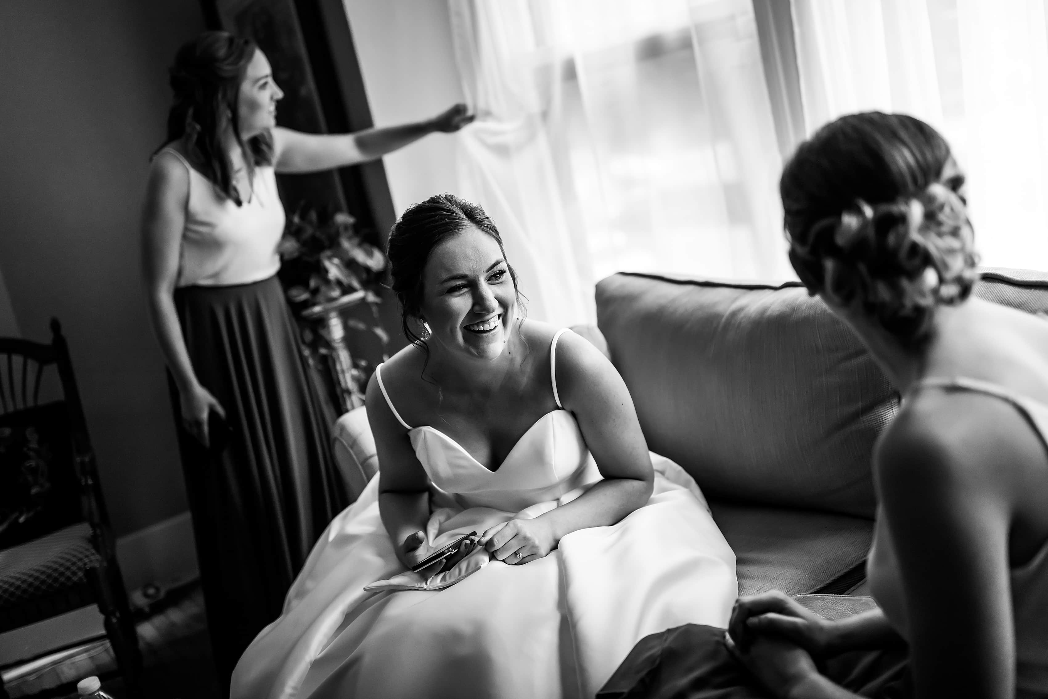 bride and sisters wait before wedding ceremony