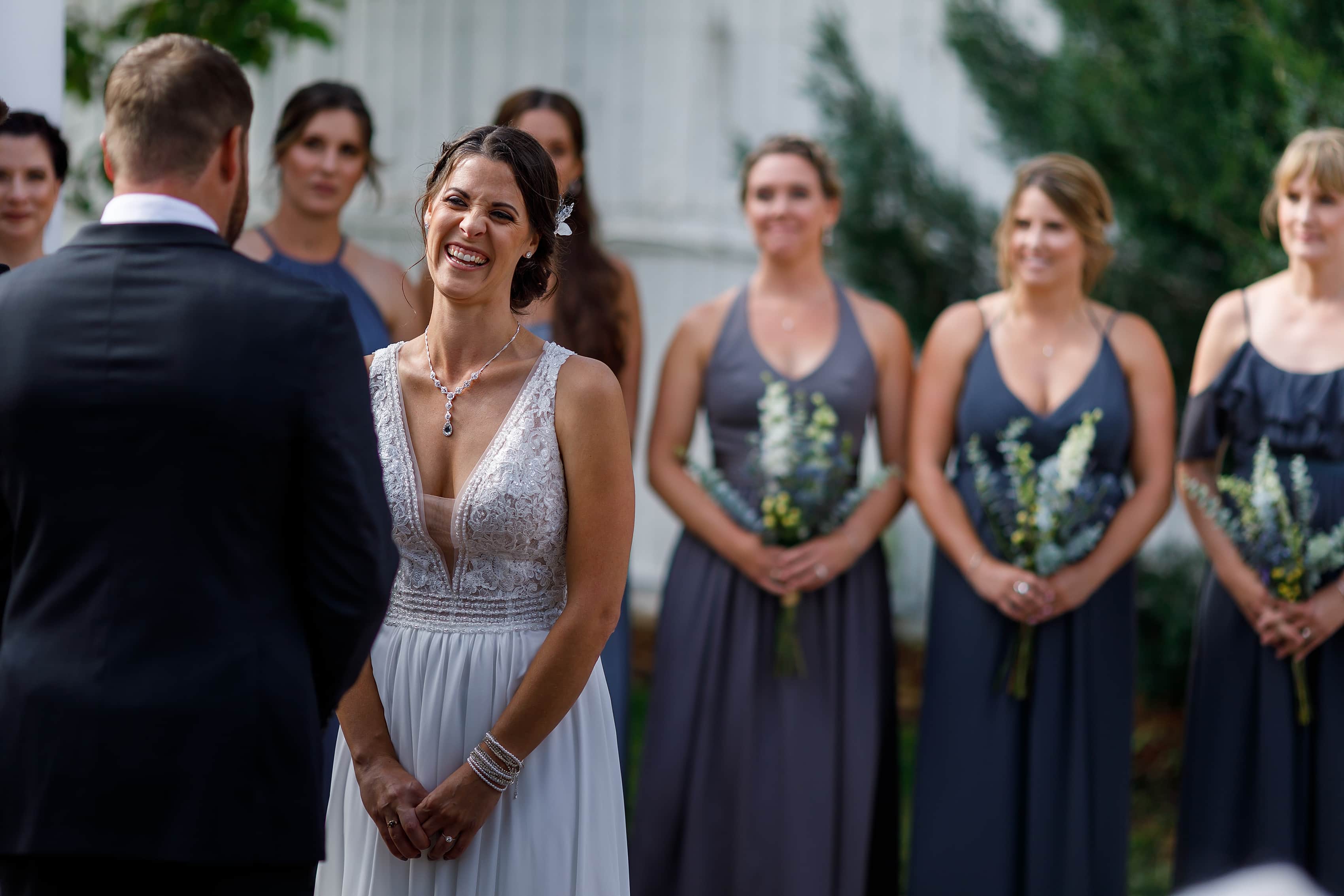 bride laughing during outdoor wedding ceremony at Lionsgate Event Center
