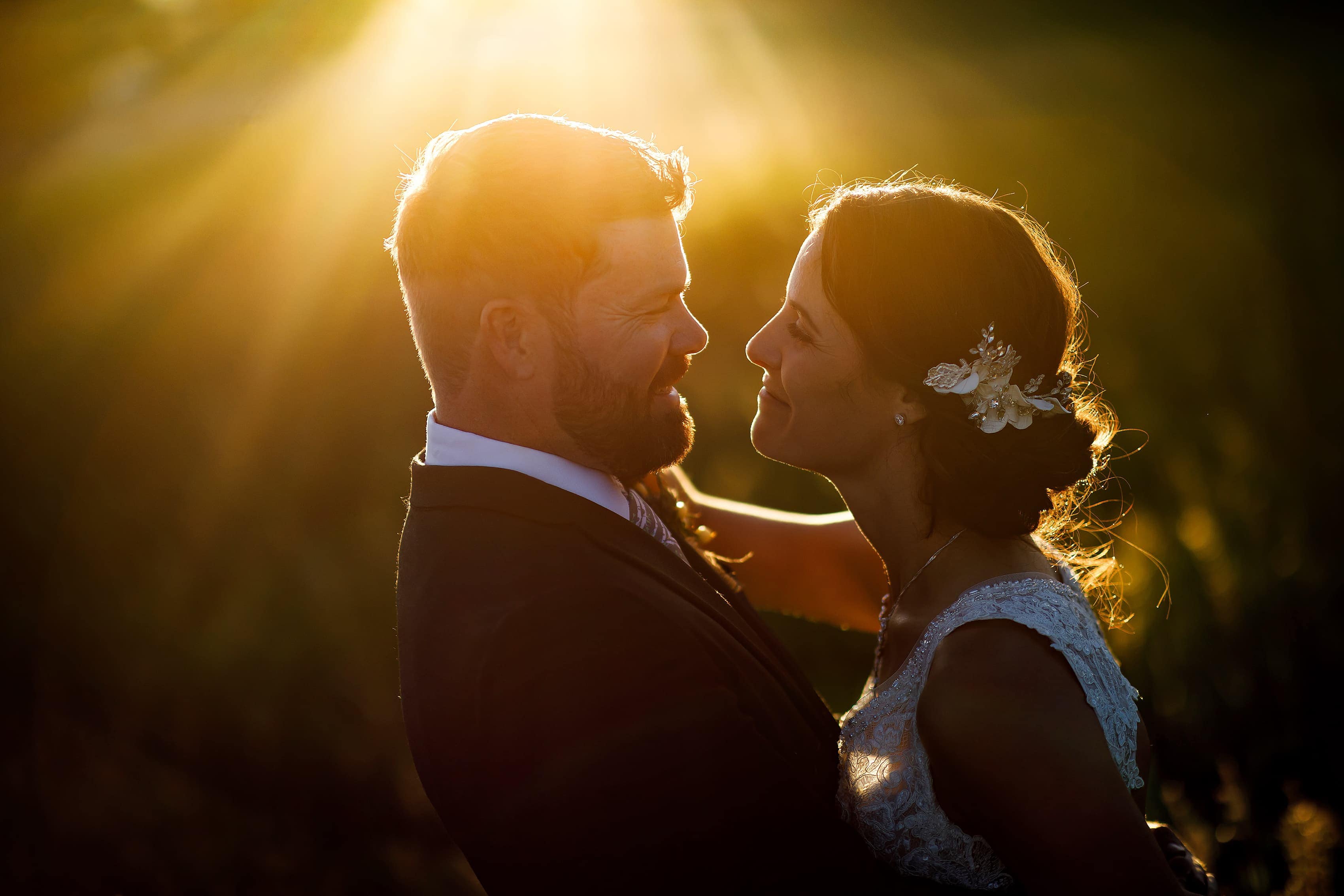 bride and groom pose for sunset portraits at Lionsgate Event Center