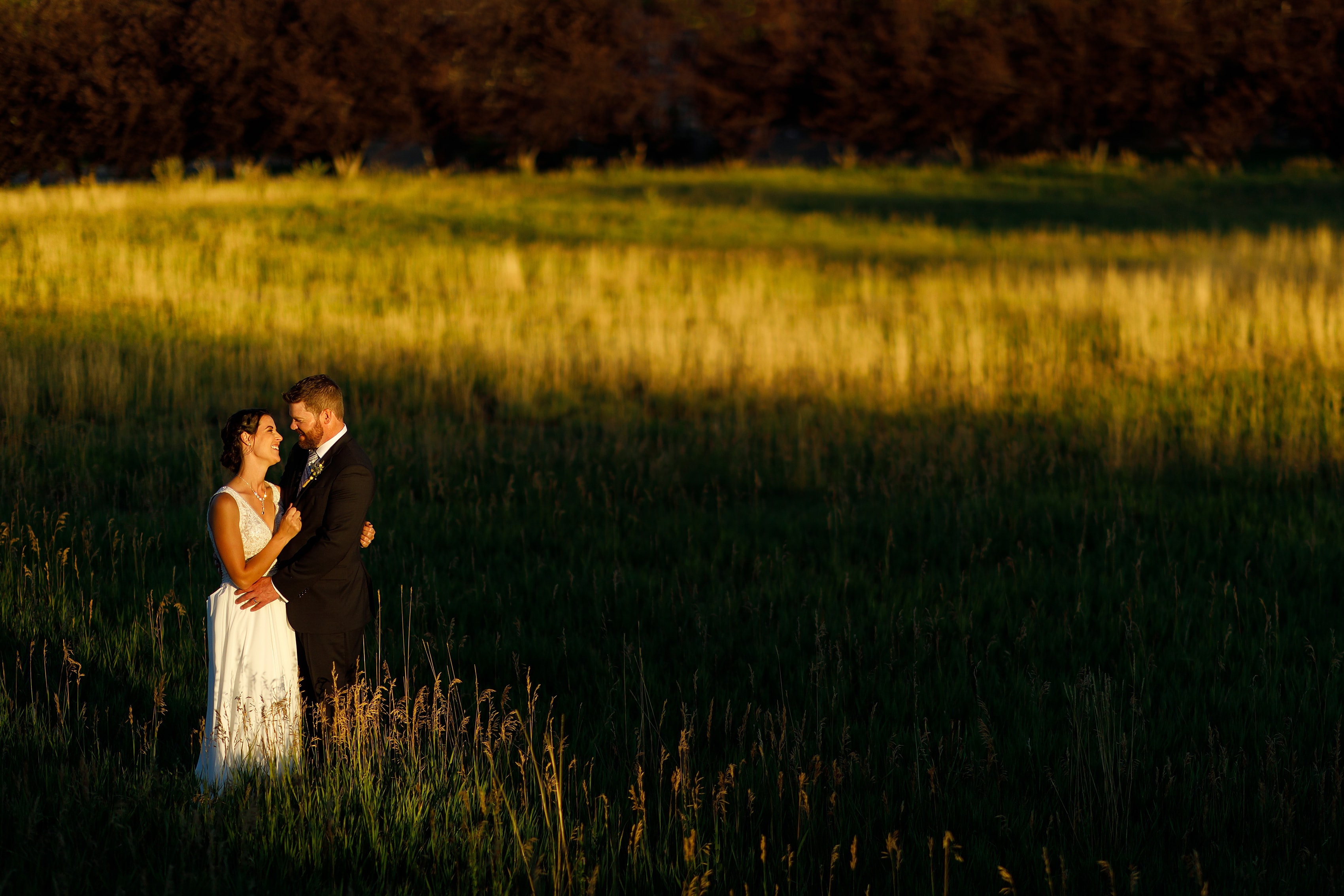 bride and groom pose for sunset portraits at Lionsgate Event Center