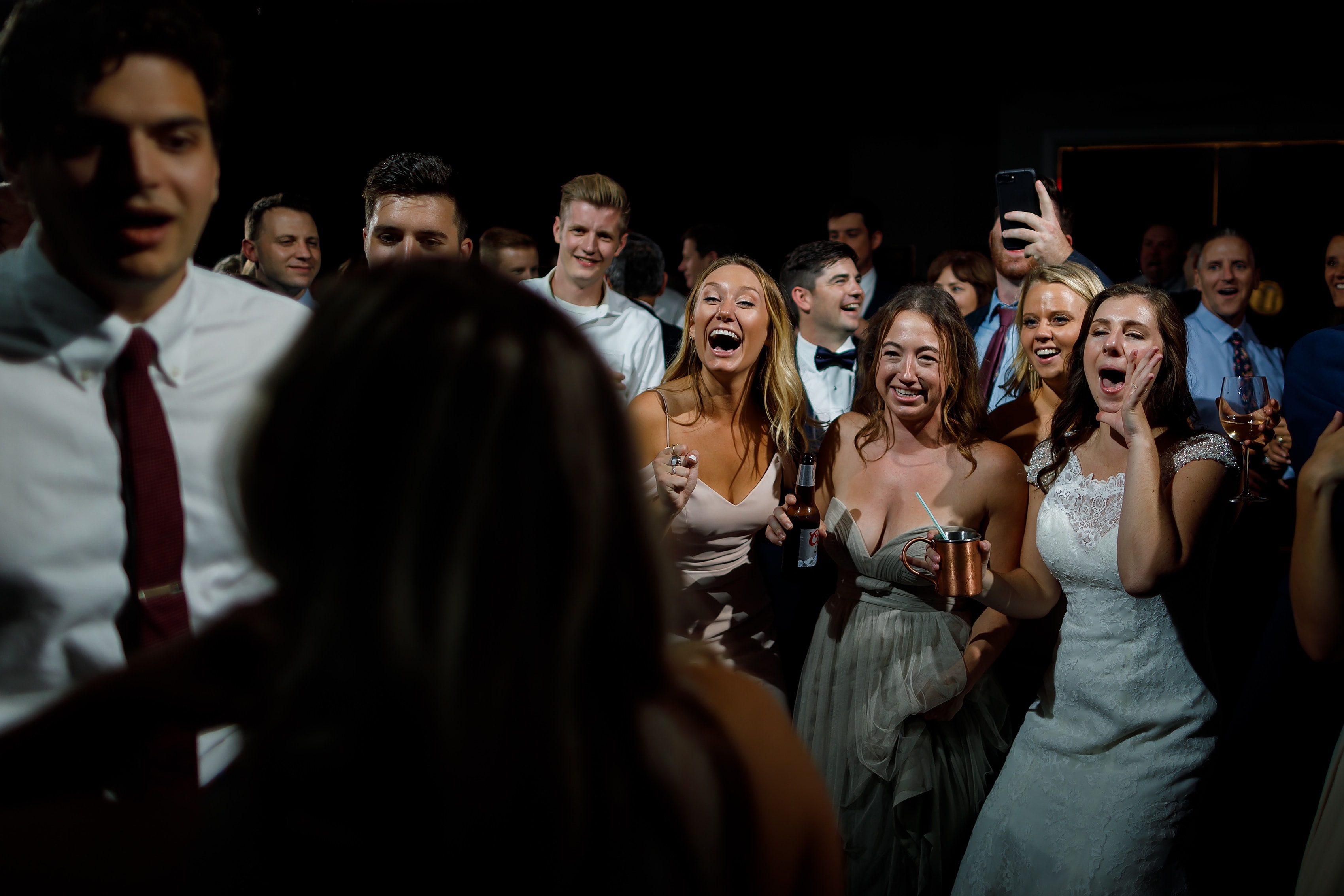 Wedding guests dance during reception at Lake Geneva Yacht Club in Lake Geneva, Wisconsin