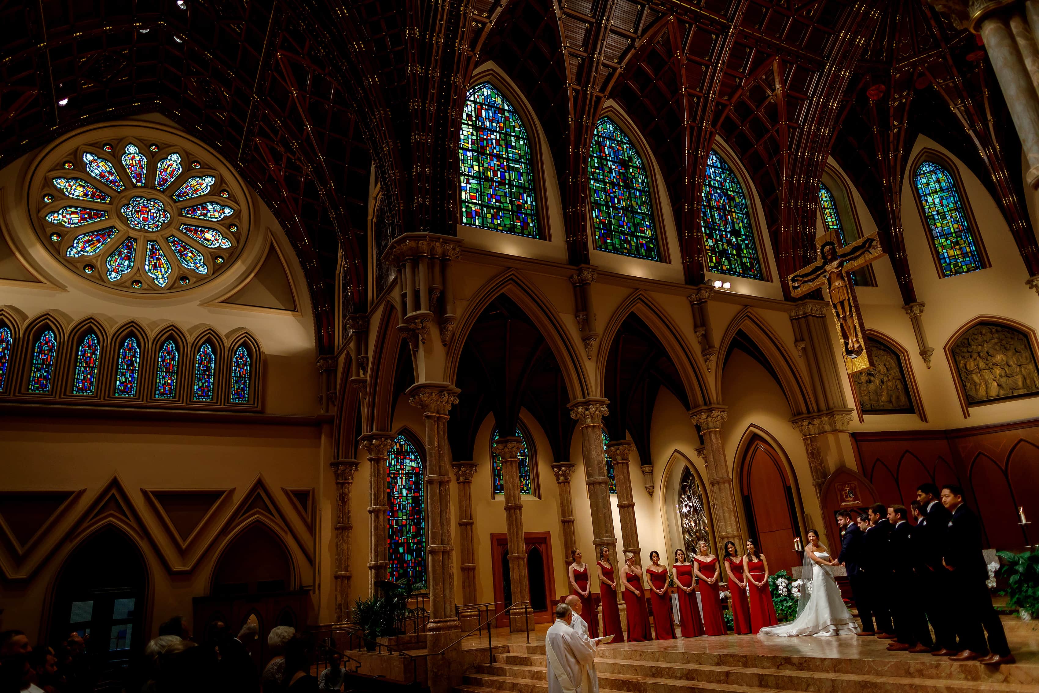 wide angle photo of wedding party at the alter during wedding at Holy Name Cathedral in downtown Chicago