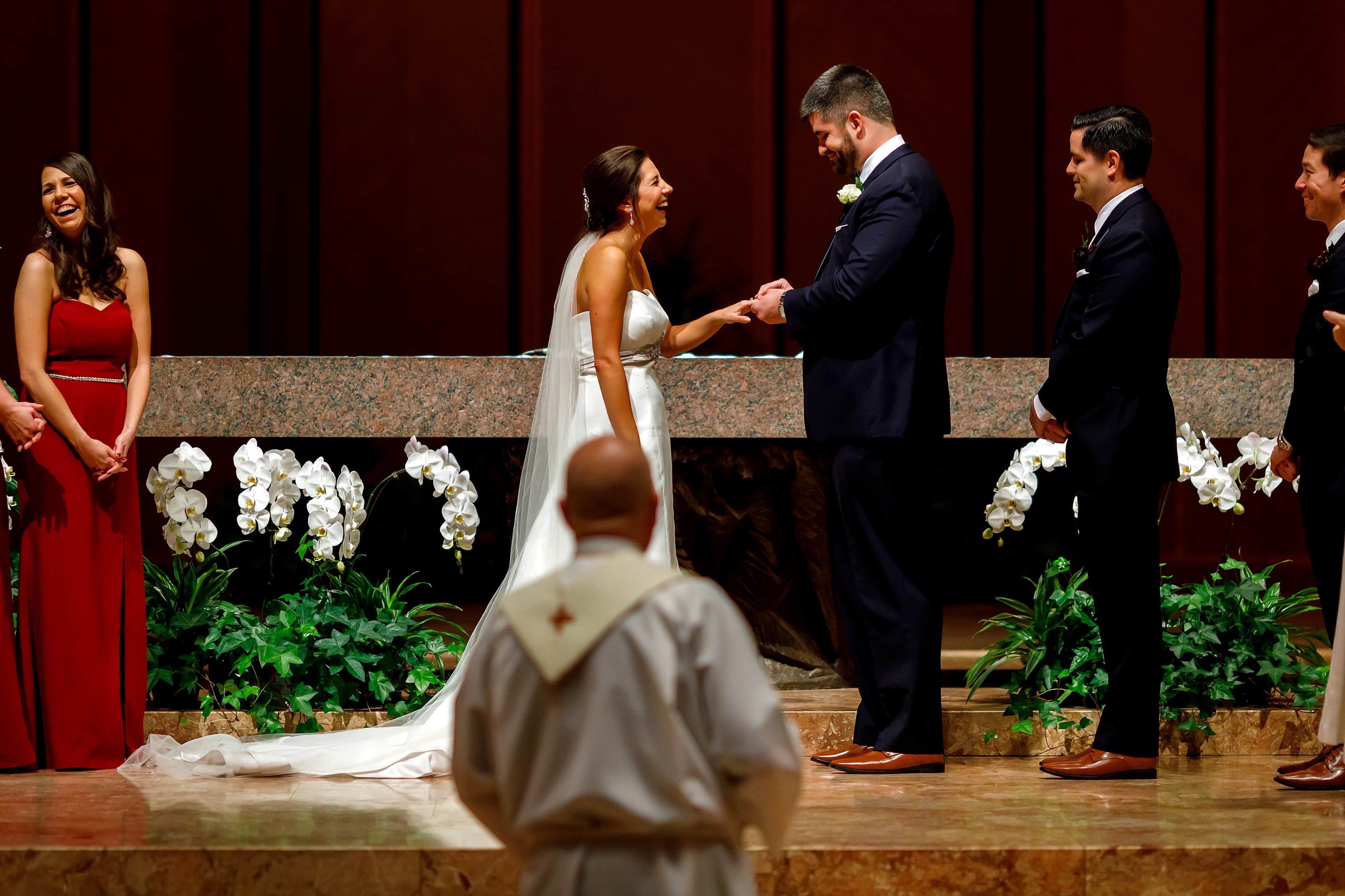 bride and groom exchange rings during wedding at Holy Name Cathedral in downtown Chicago
