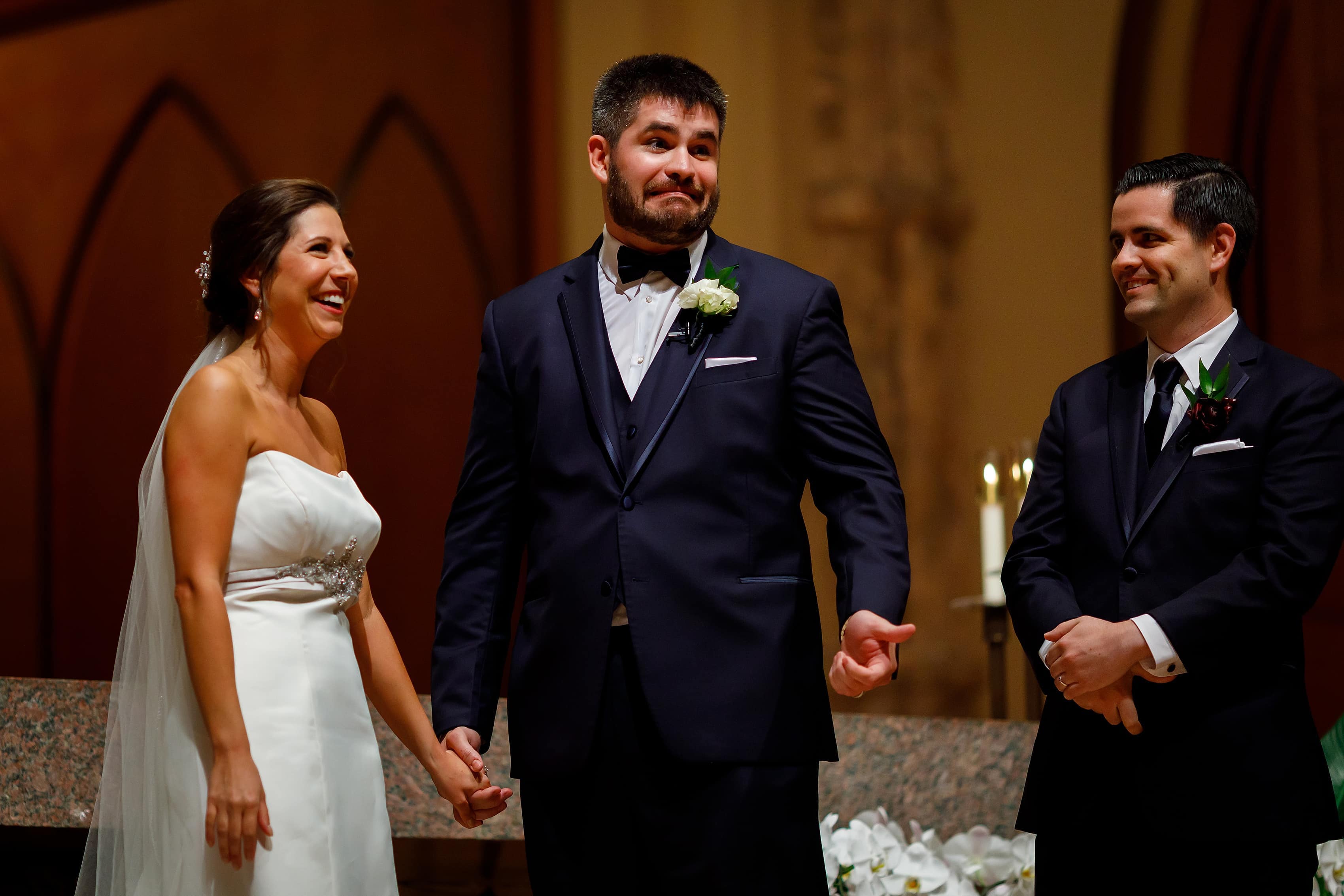 bride and groom exchange vows during wedding at Holy Name Cathedral in downtown Chicago