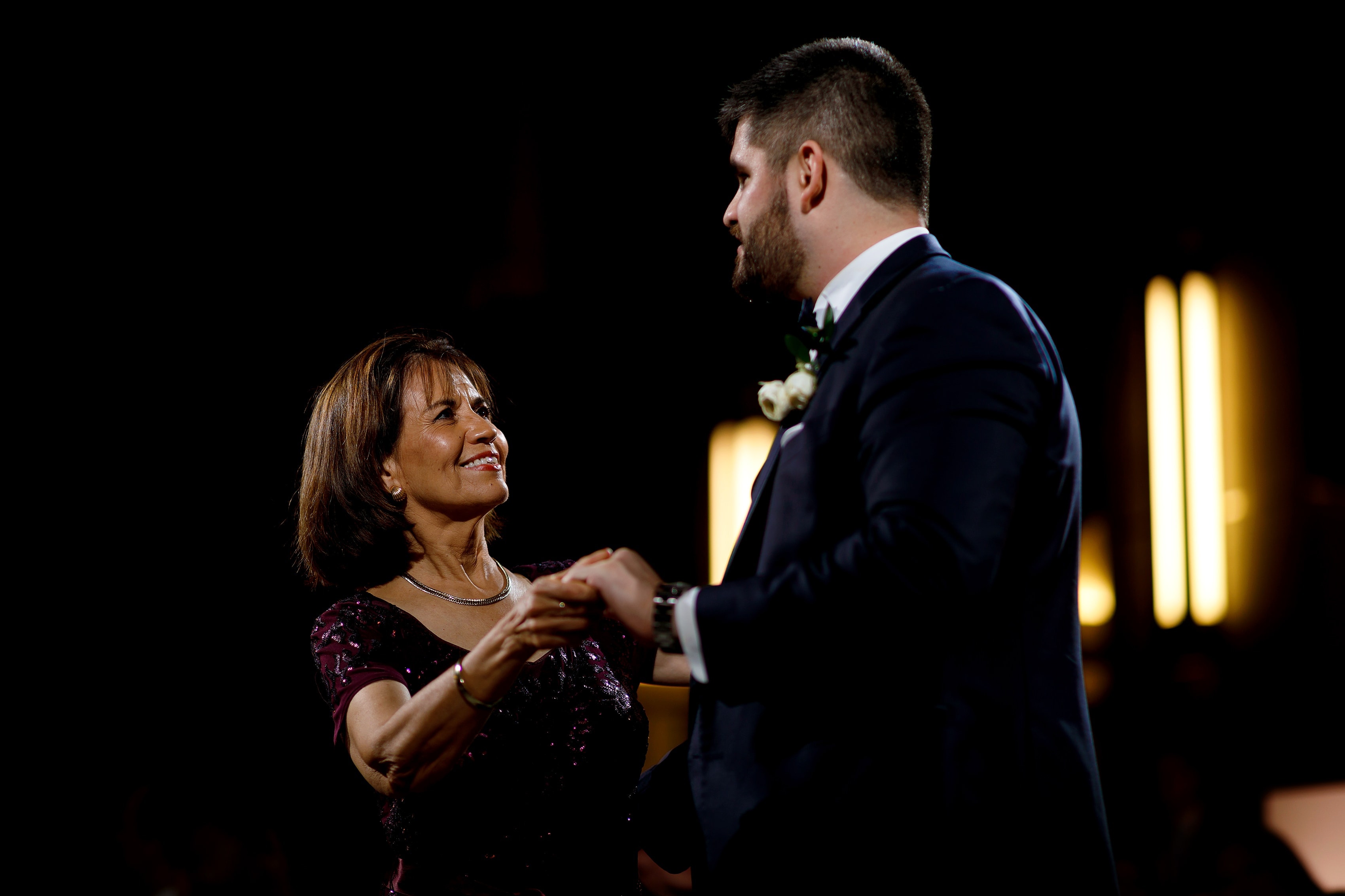 mother of the groom shares dance with her son during wedding reception at Pazzo's at Three-Eleven in downtown Chicago