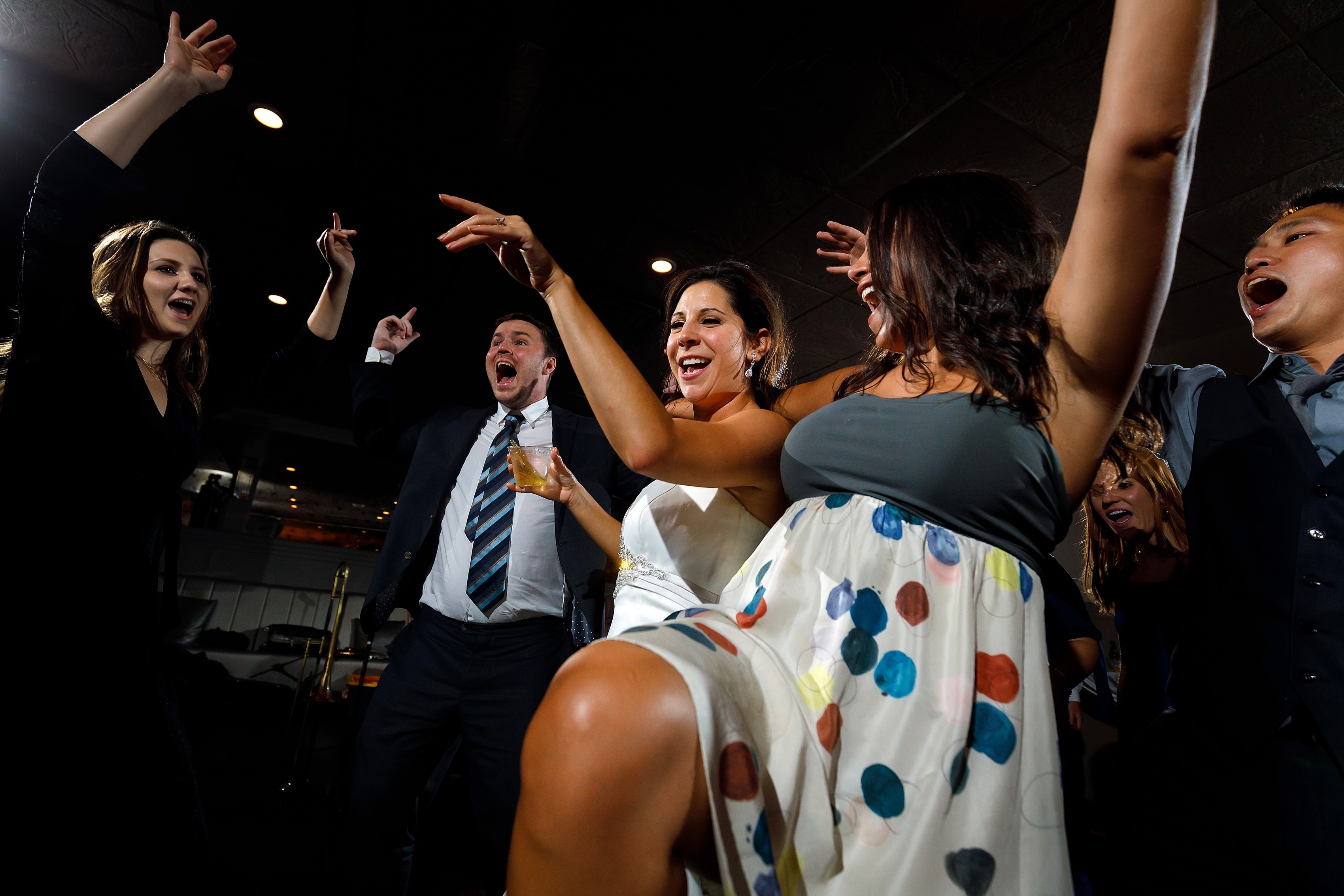 wedding guests dance during wedding reception at Pazzo's at Three-Eleven in downtown Chicago