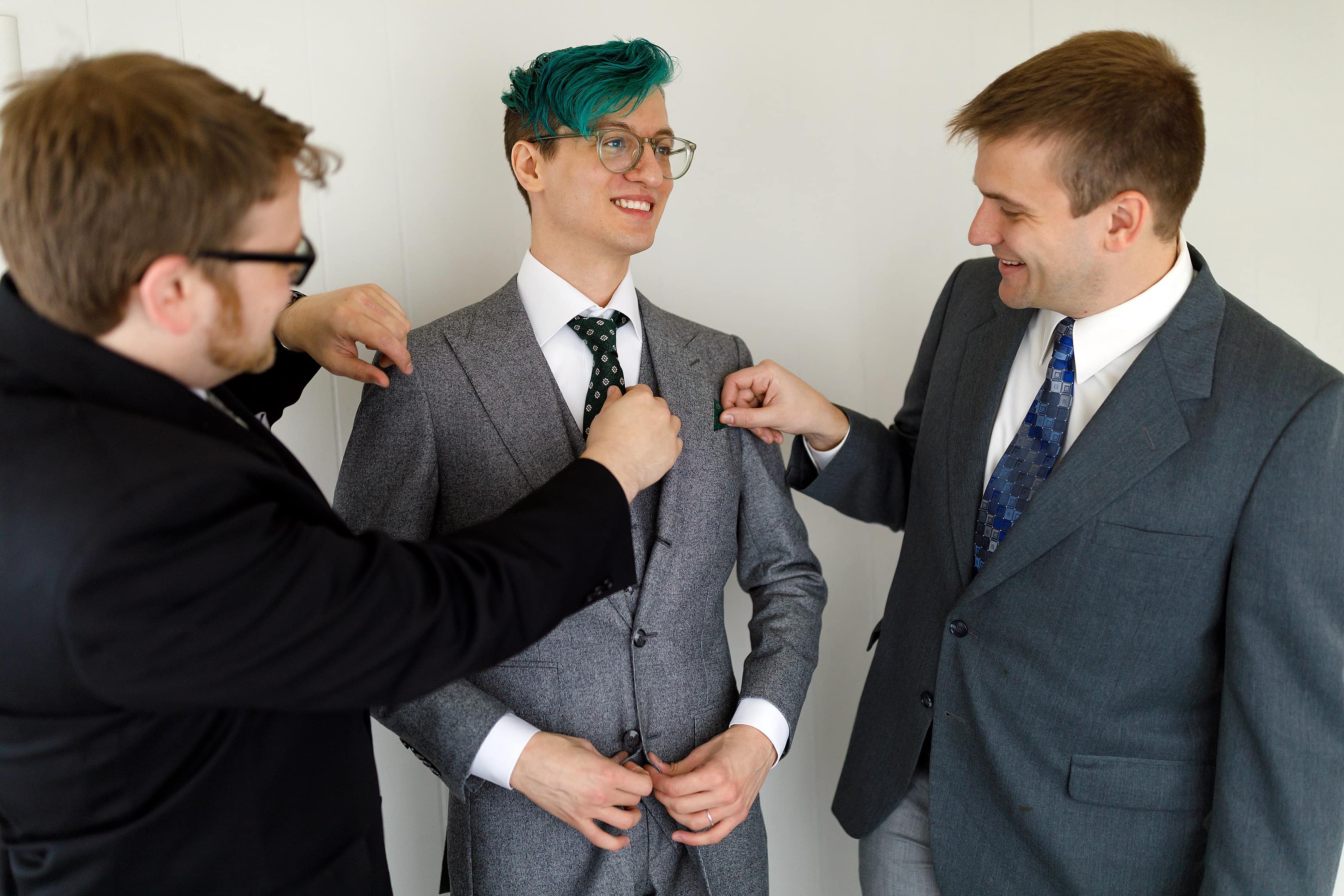 groom and groomsmen get ready for wedding
