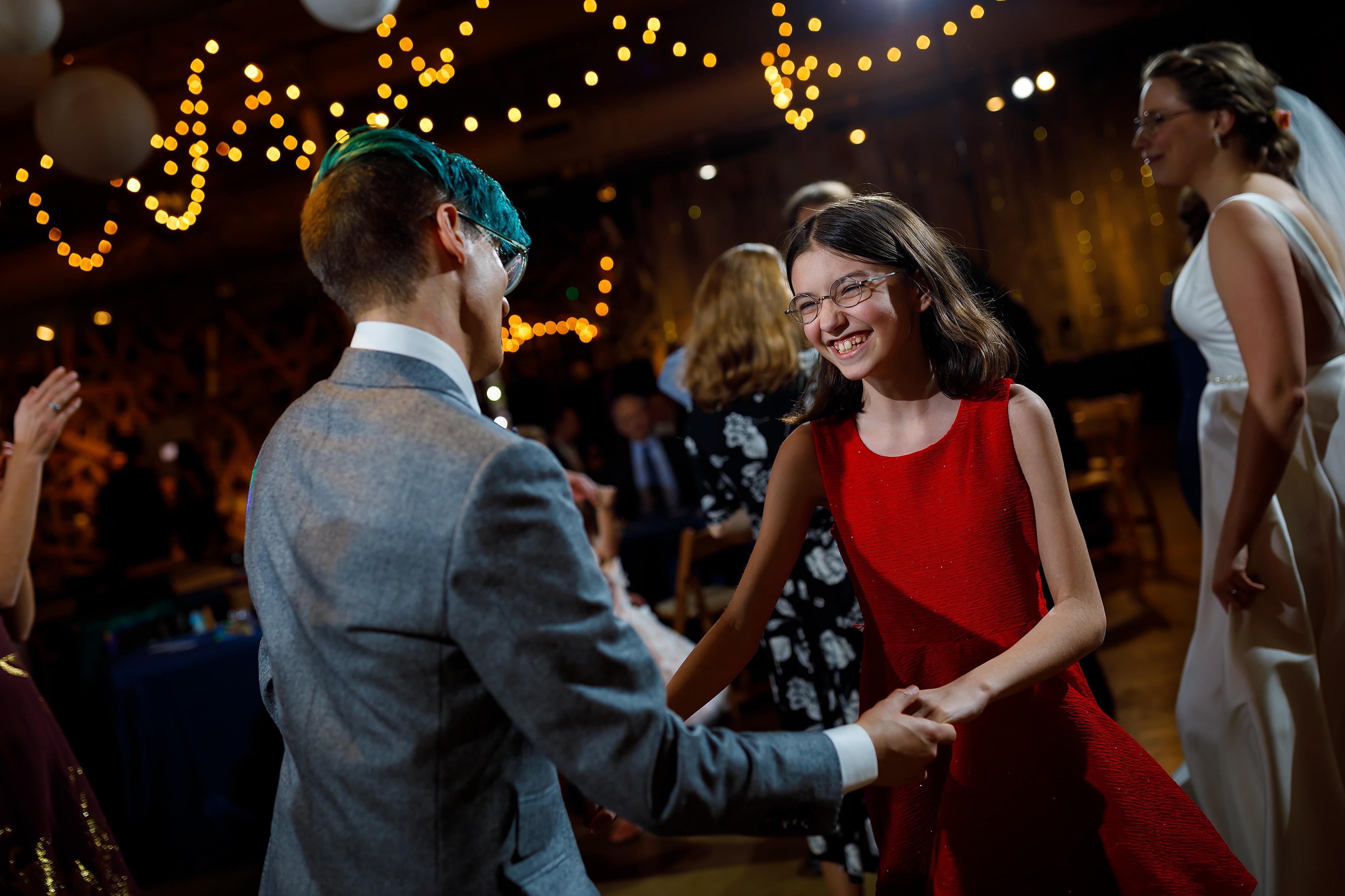 wedding guests dance during wedding reception at Rust Belt Market in downtown Ferndale, Michigan