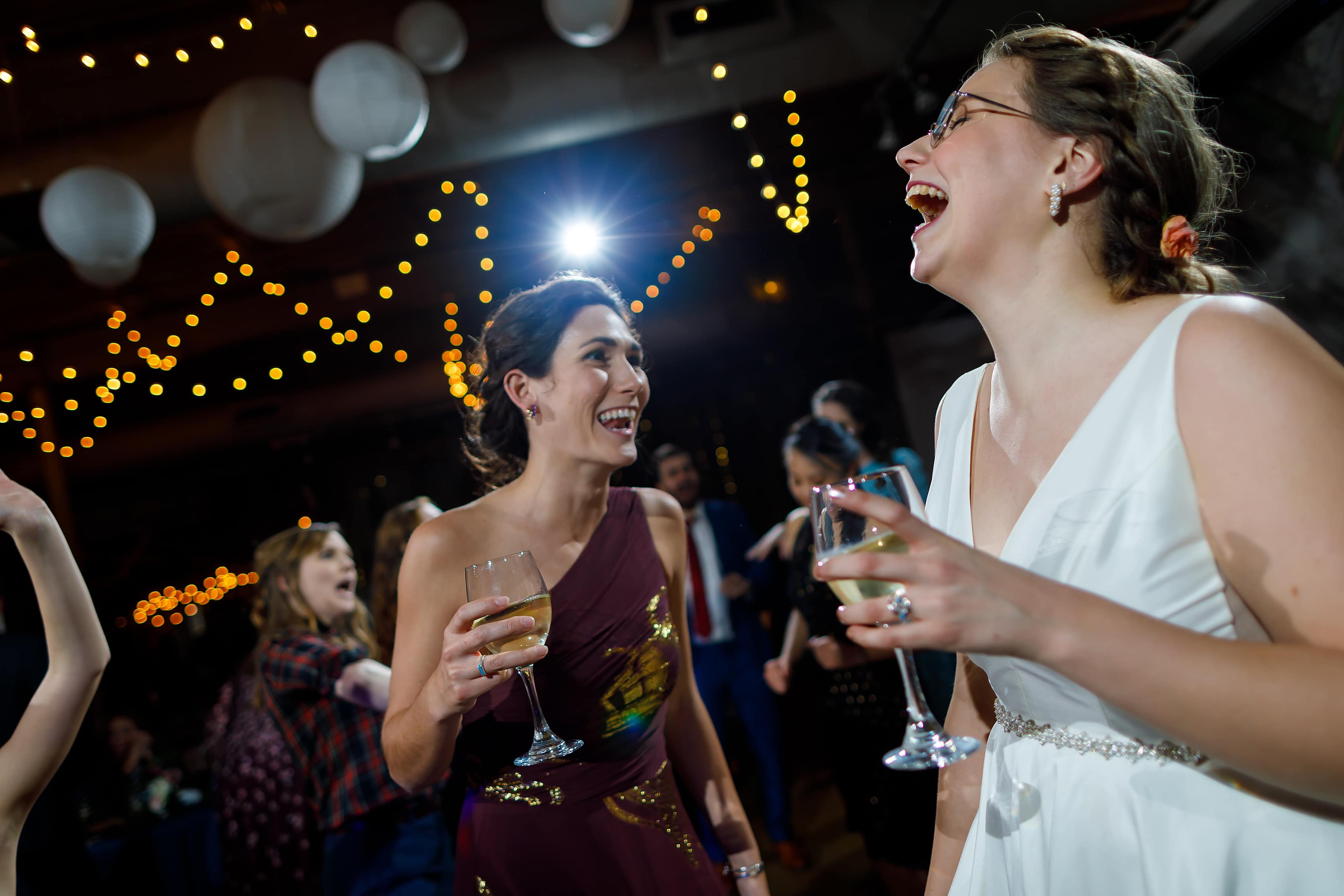 wedding guests dance during wedding reception at Rust Belt Market in downtown Ferndale, Michigan