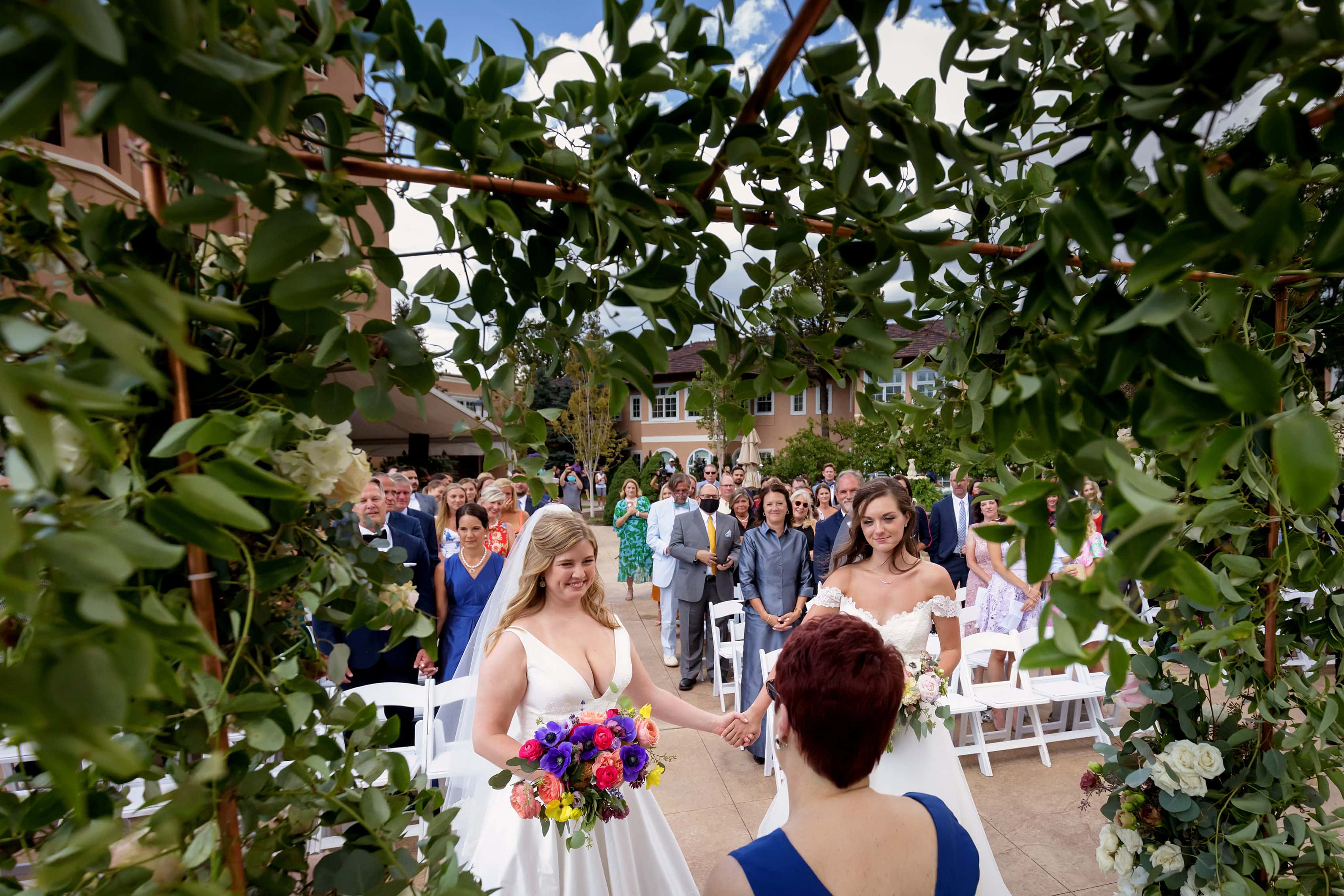 wedding ceremony with two brides at The Broadmoor in Colorado Springs, Colorado