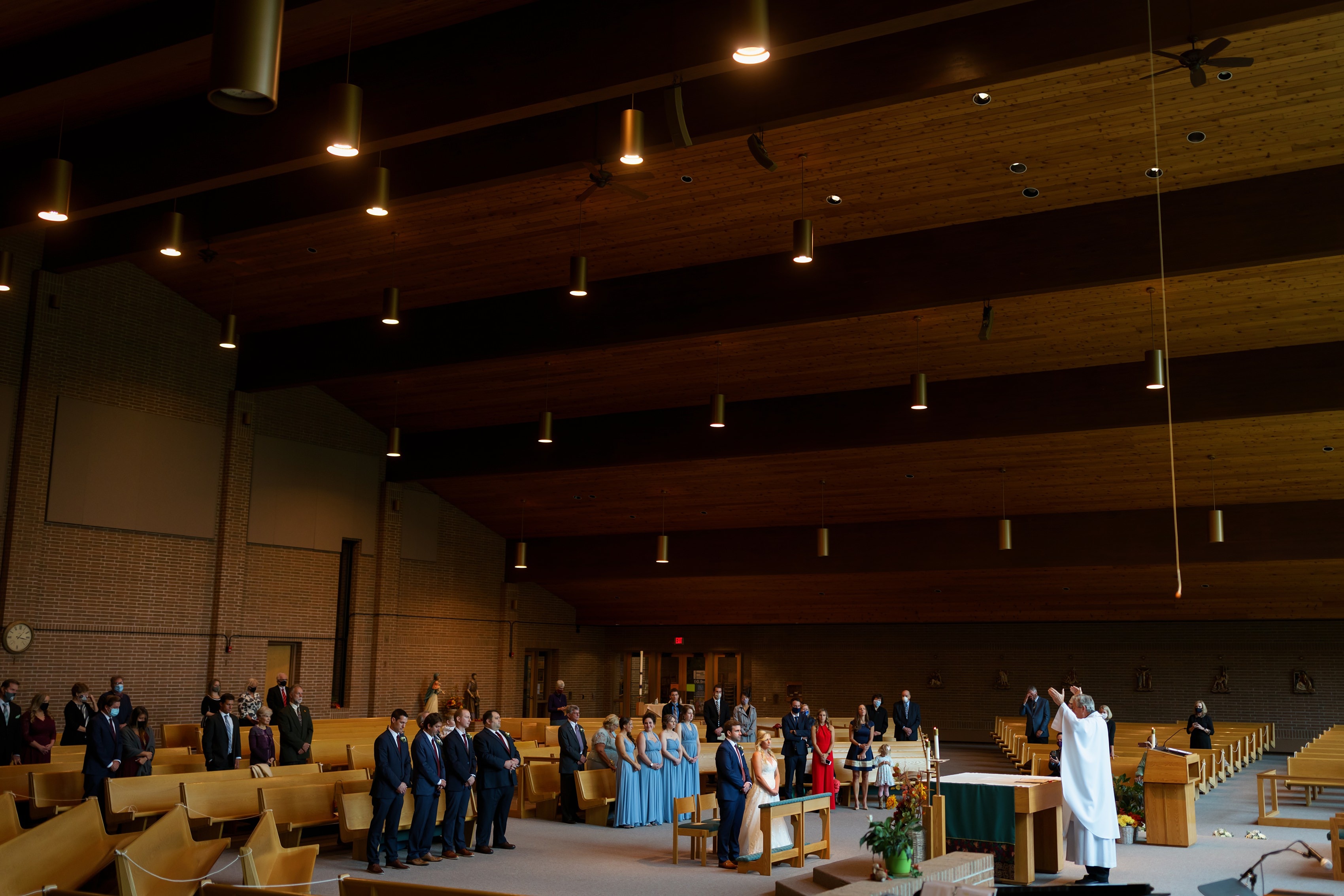 wide angle photo of wedding ceremony at Cross in the Woods in Indian River, Michigan
