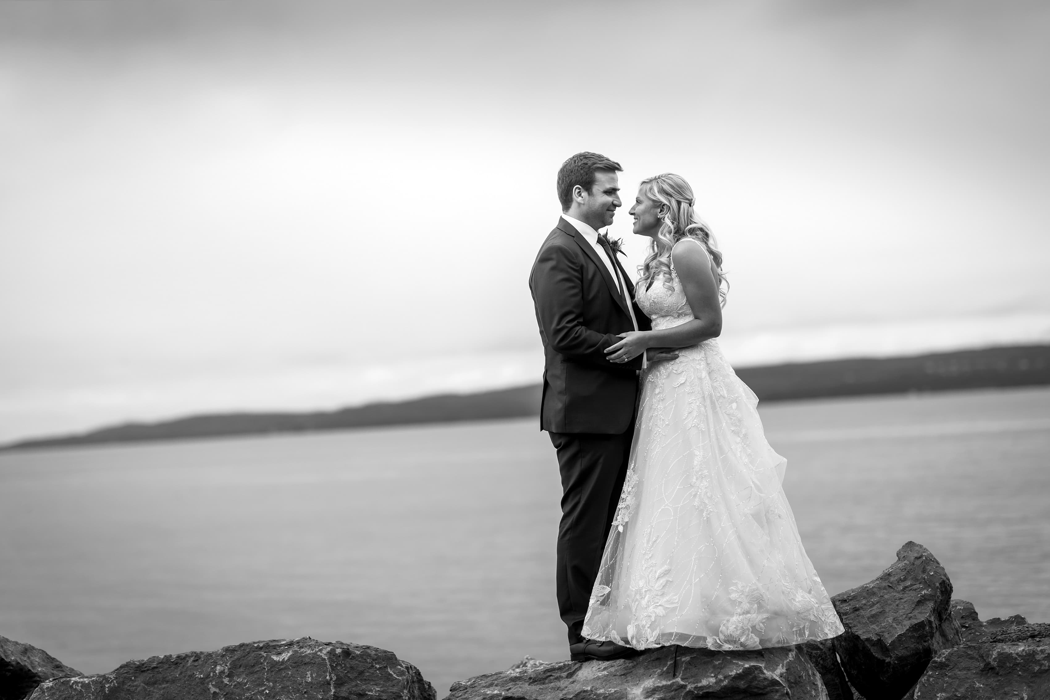 bride and groom pose for wedding portraits at Bay Harbor Inn in Petoskey, Michigan
