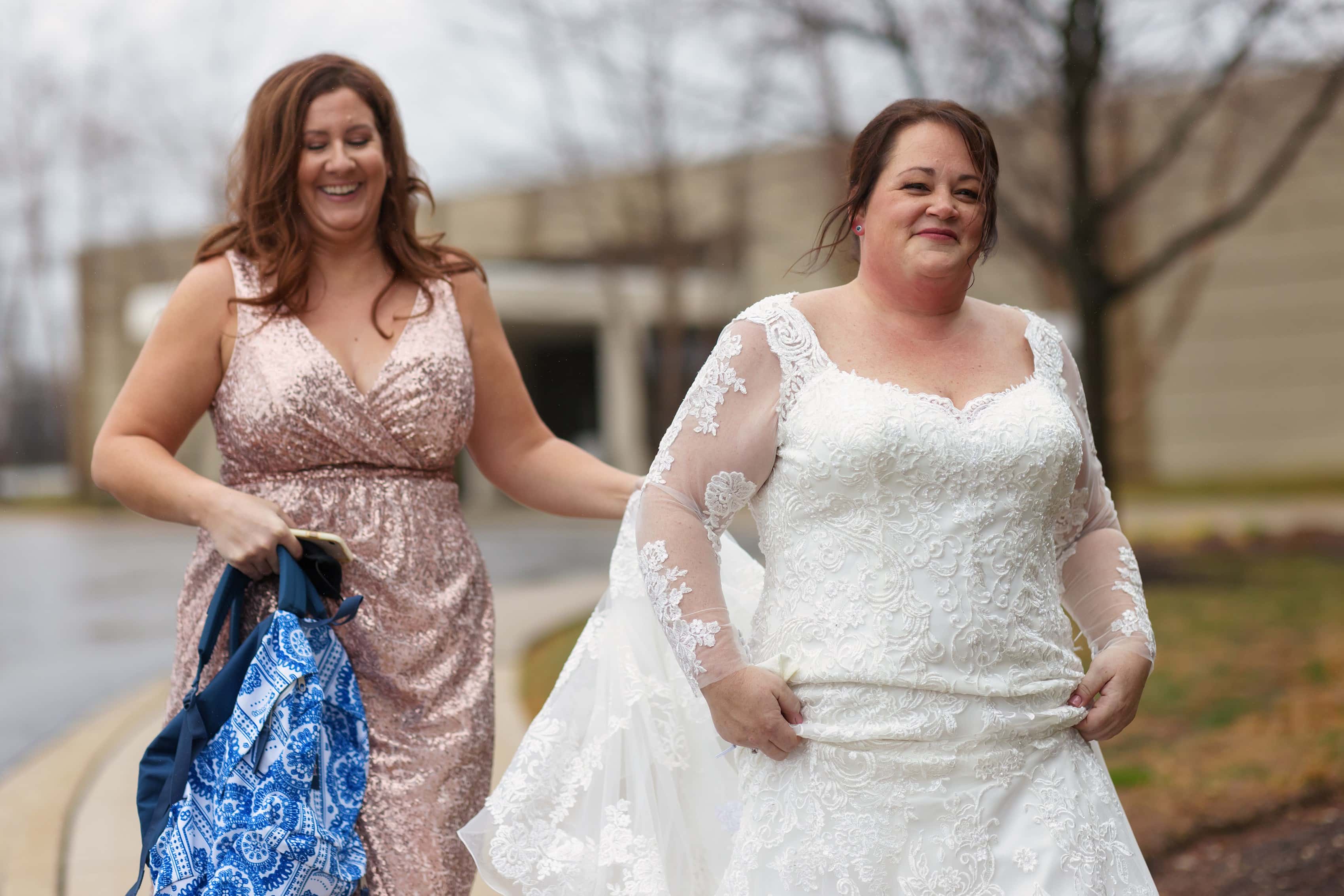 bridesmaid walks with bride to first look