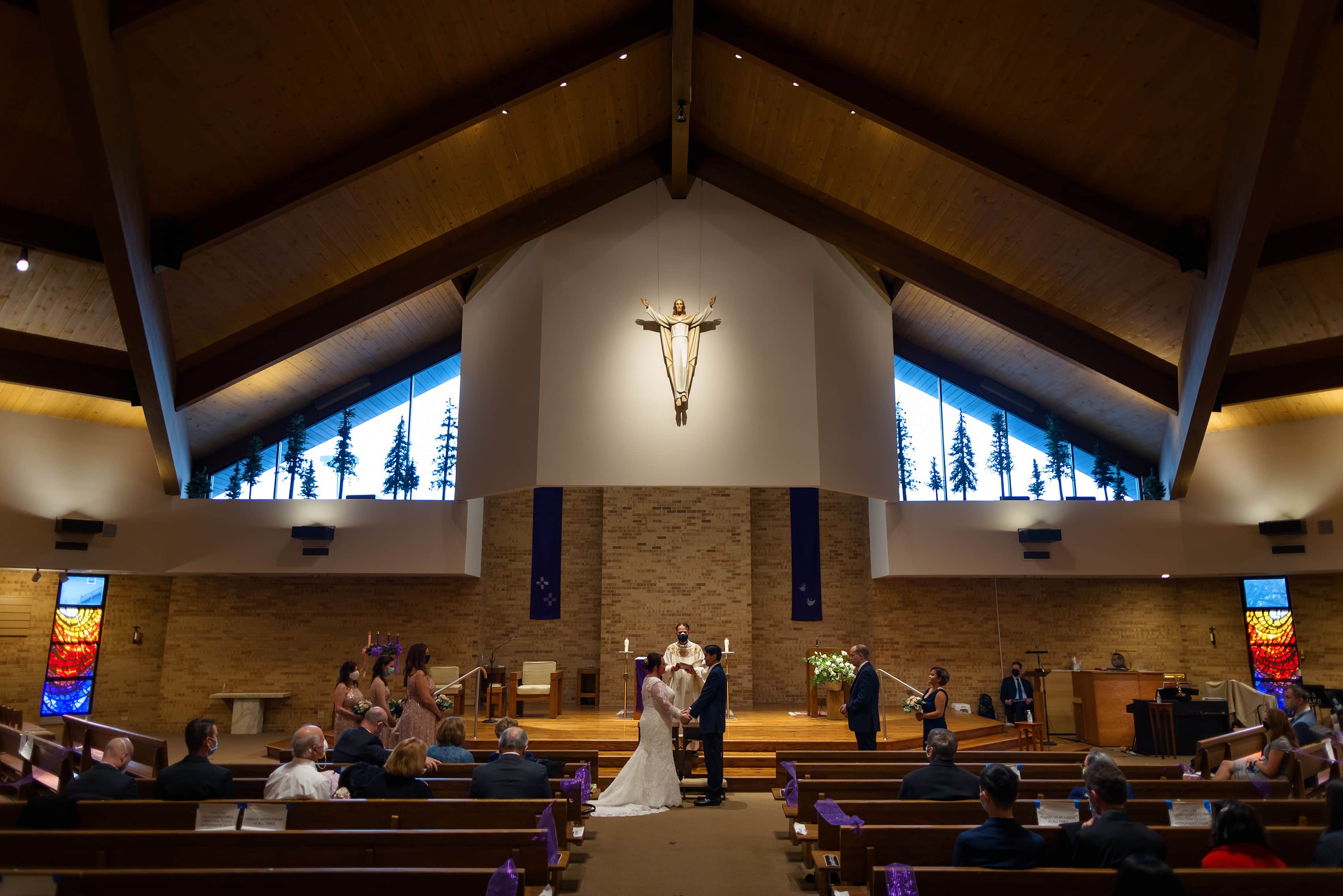 wide angle view of wedding ceremony at St. Scholastica parish