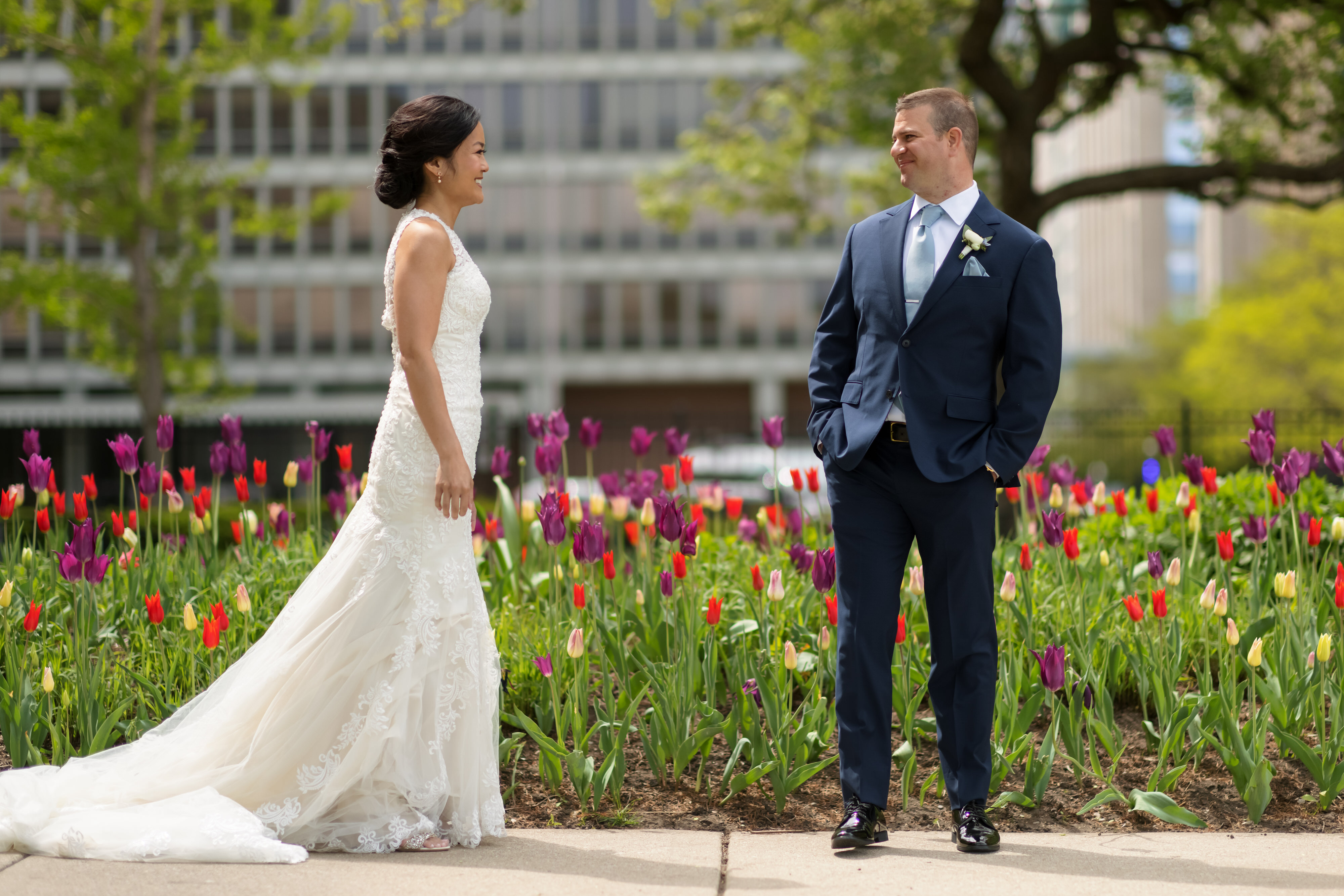 Bride and groom see each other for a first look in front of Tulips along Lakeshore Drive in downtown Chicago