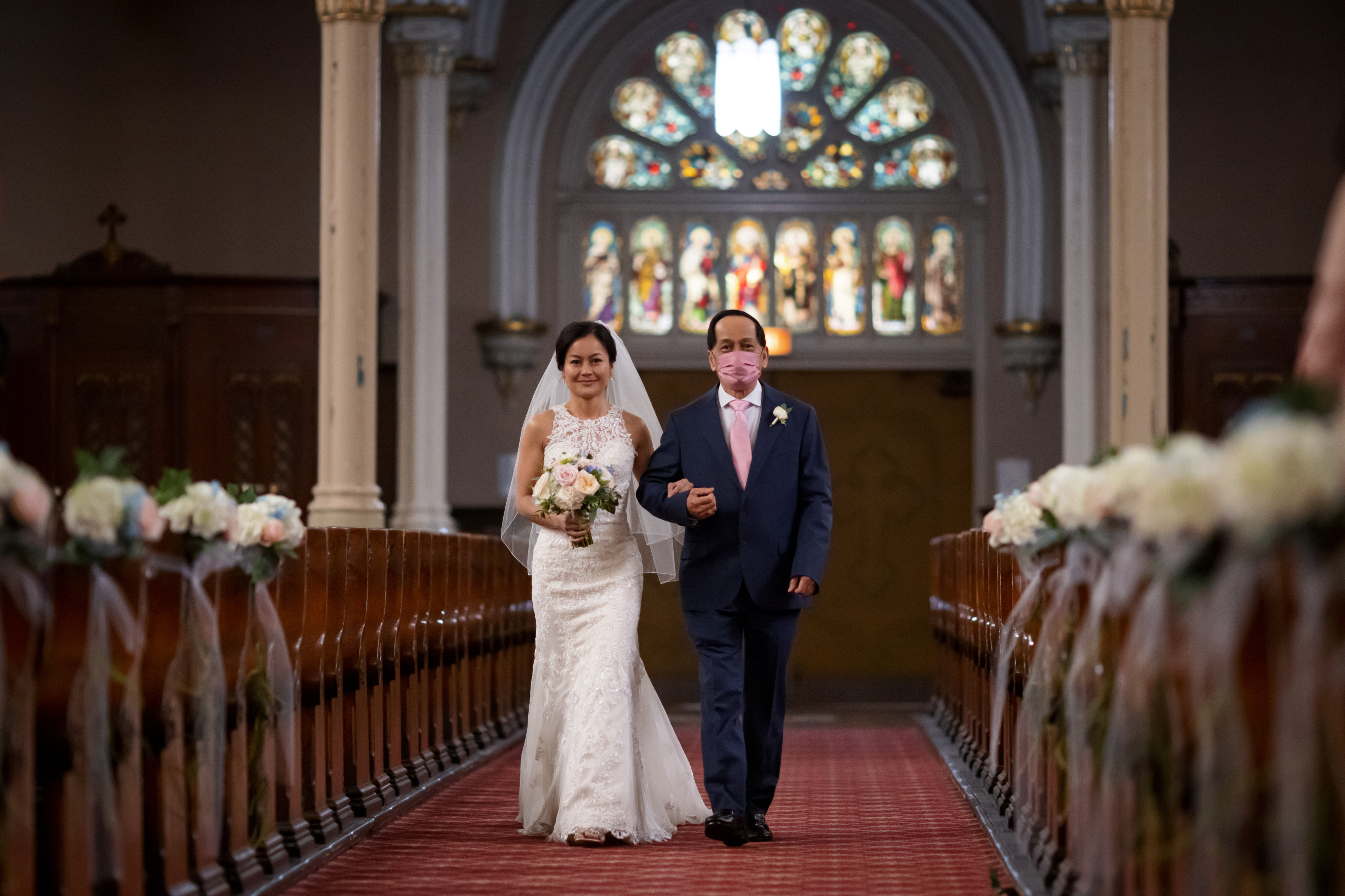 Bride and father walk down the aisle during wedding ceremony at St. Michael Old Town in Chicago