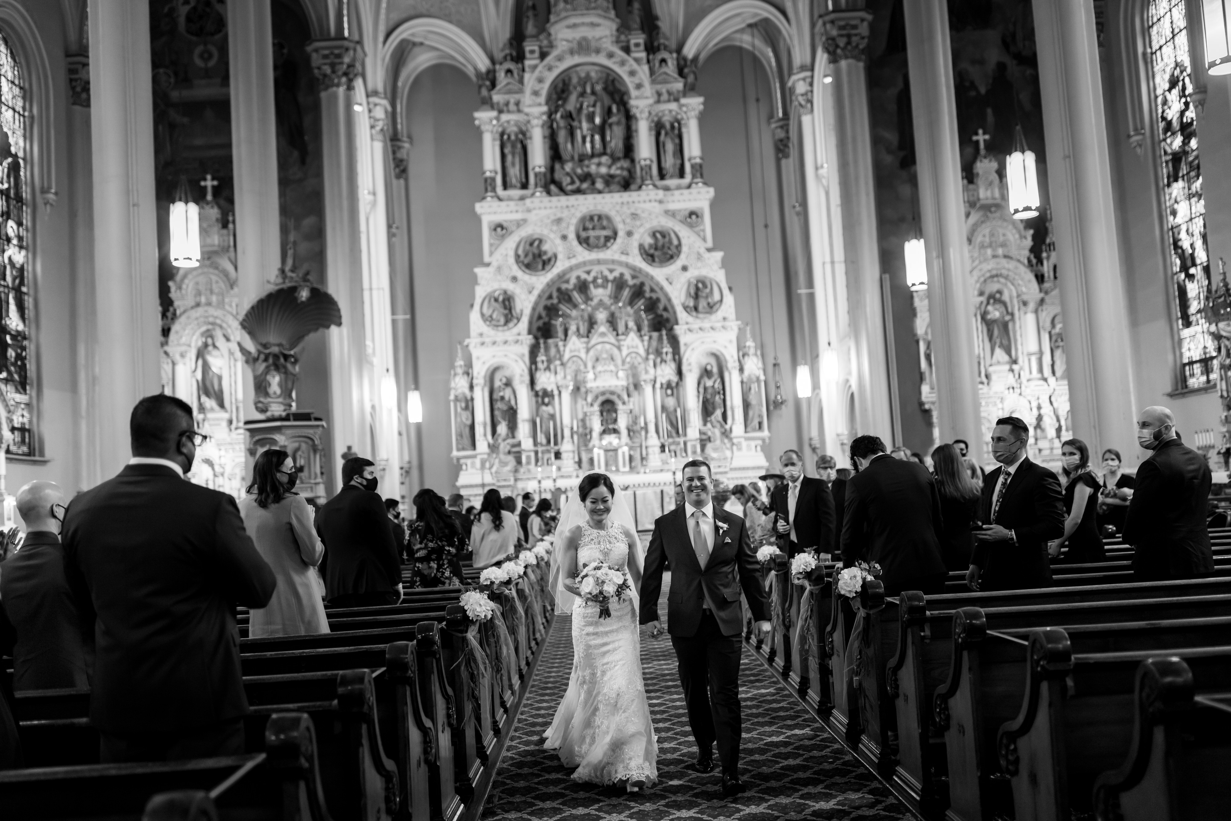 Bride and groom walk back down the aisle during wedding ceremony at St. Michael Old Town in Chicago