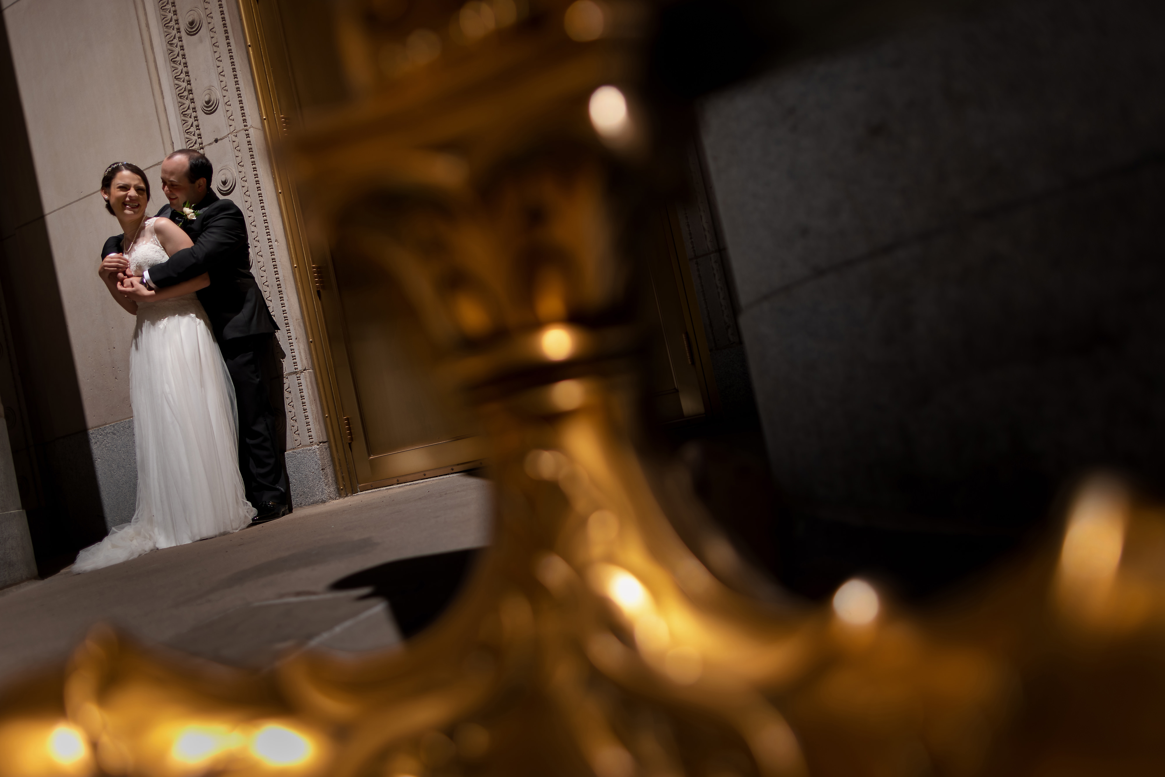 Bride and Groom pose for portrait on LaSalle Street in downtown Chicago
