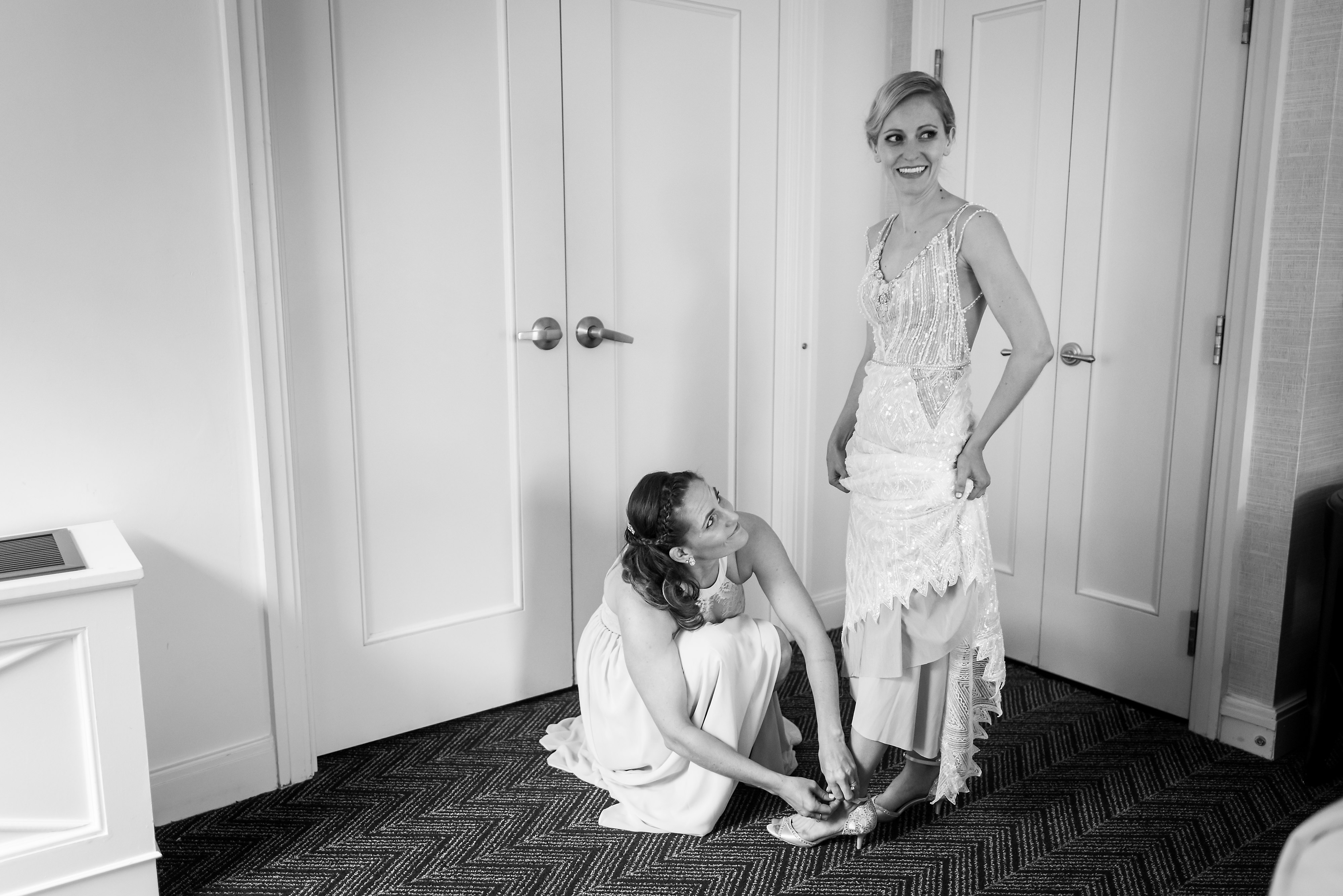 bride and sister getting ready