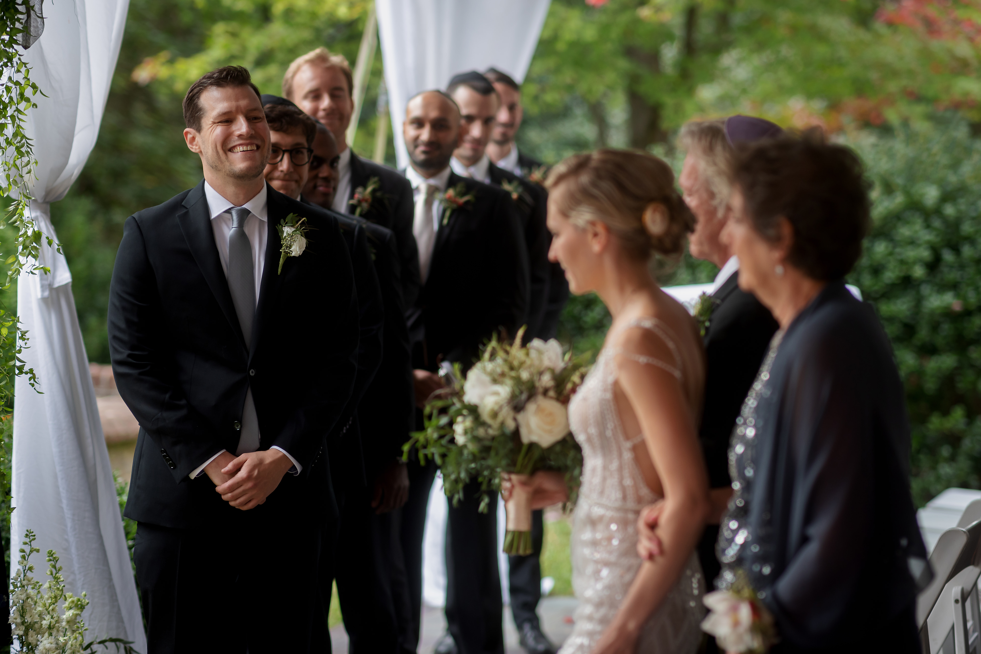 bride walking down aisle with parents during ceremony at Mount Vernon in Virginia