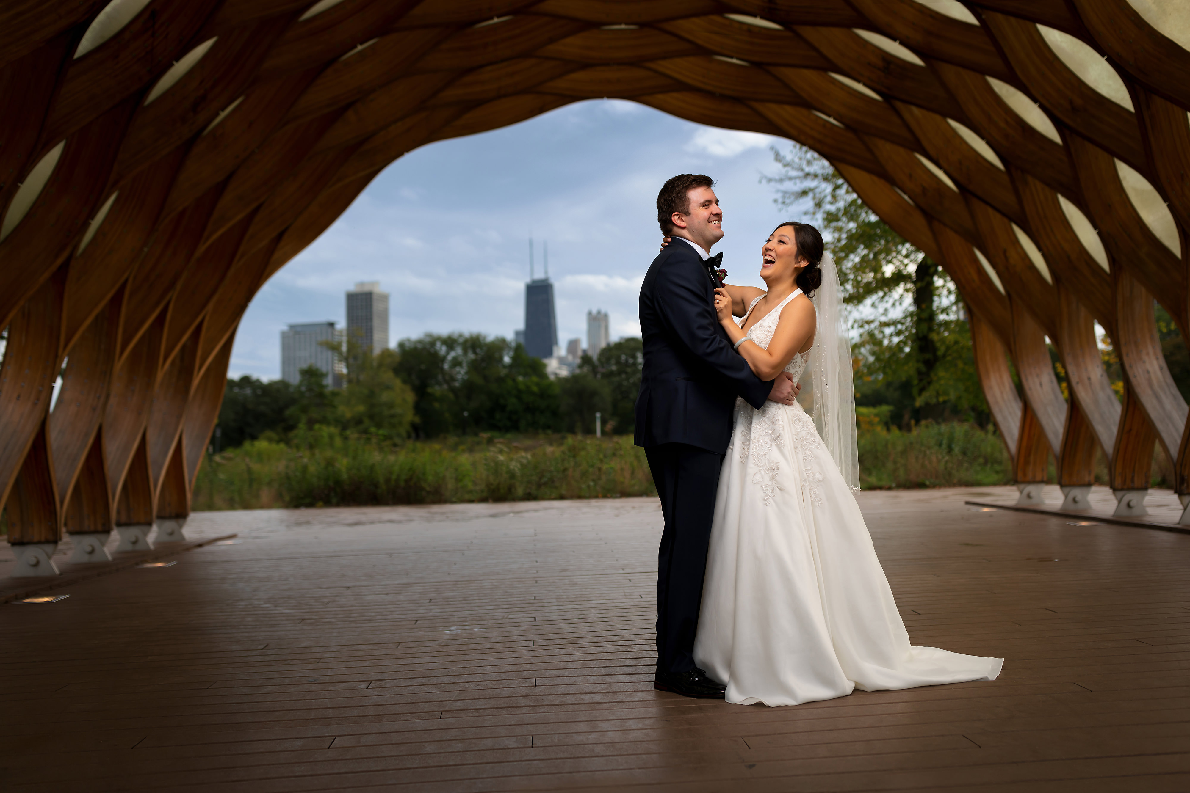 bride and groom under wooden arch honeycomb at Lincoln Park
