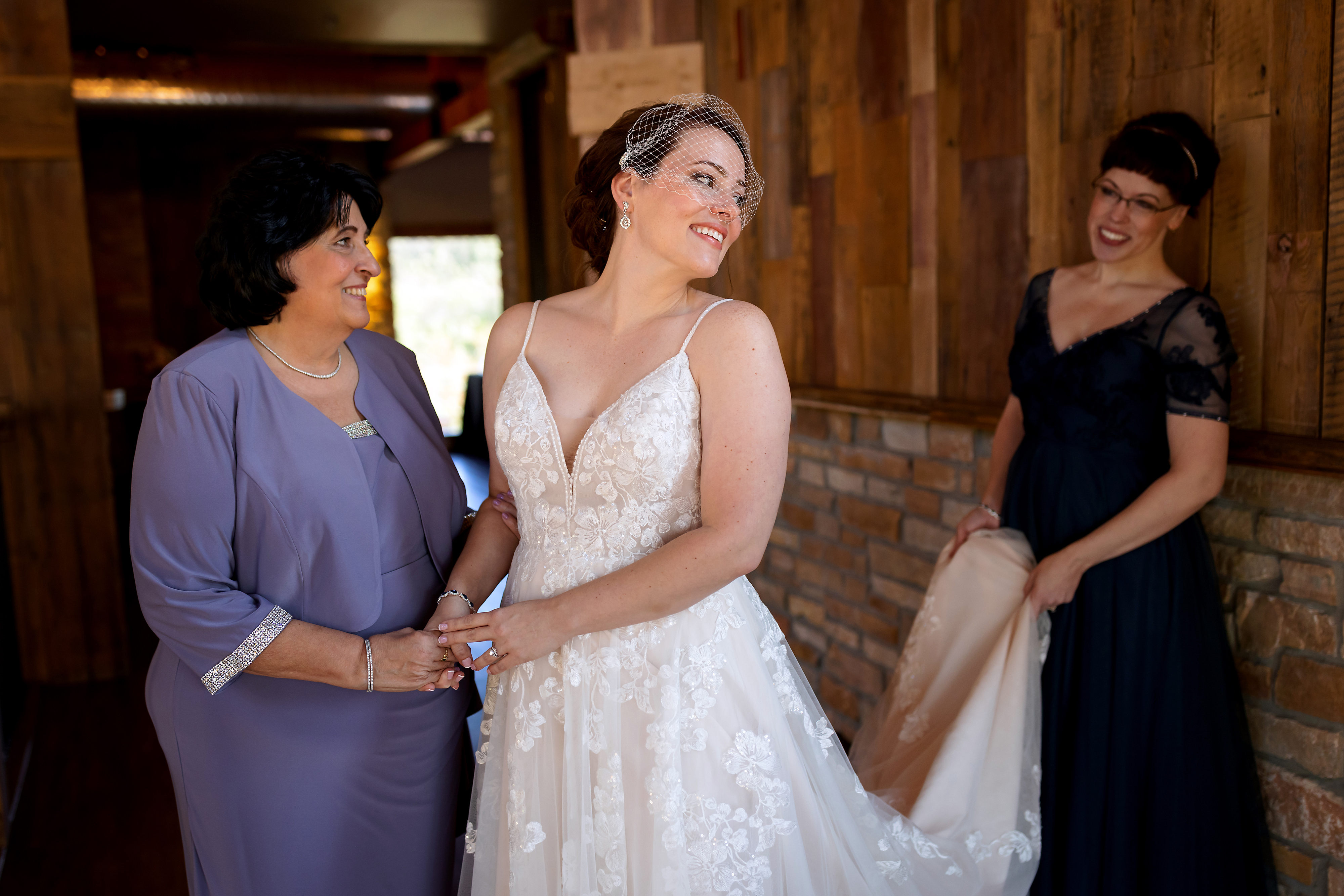 Bride and sister and mother getting ready