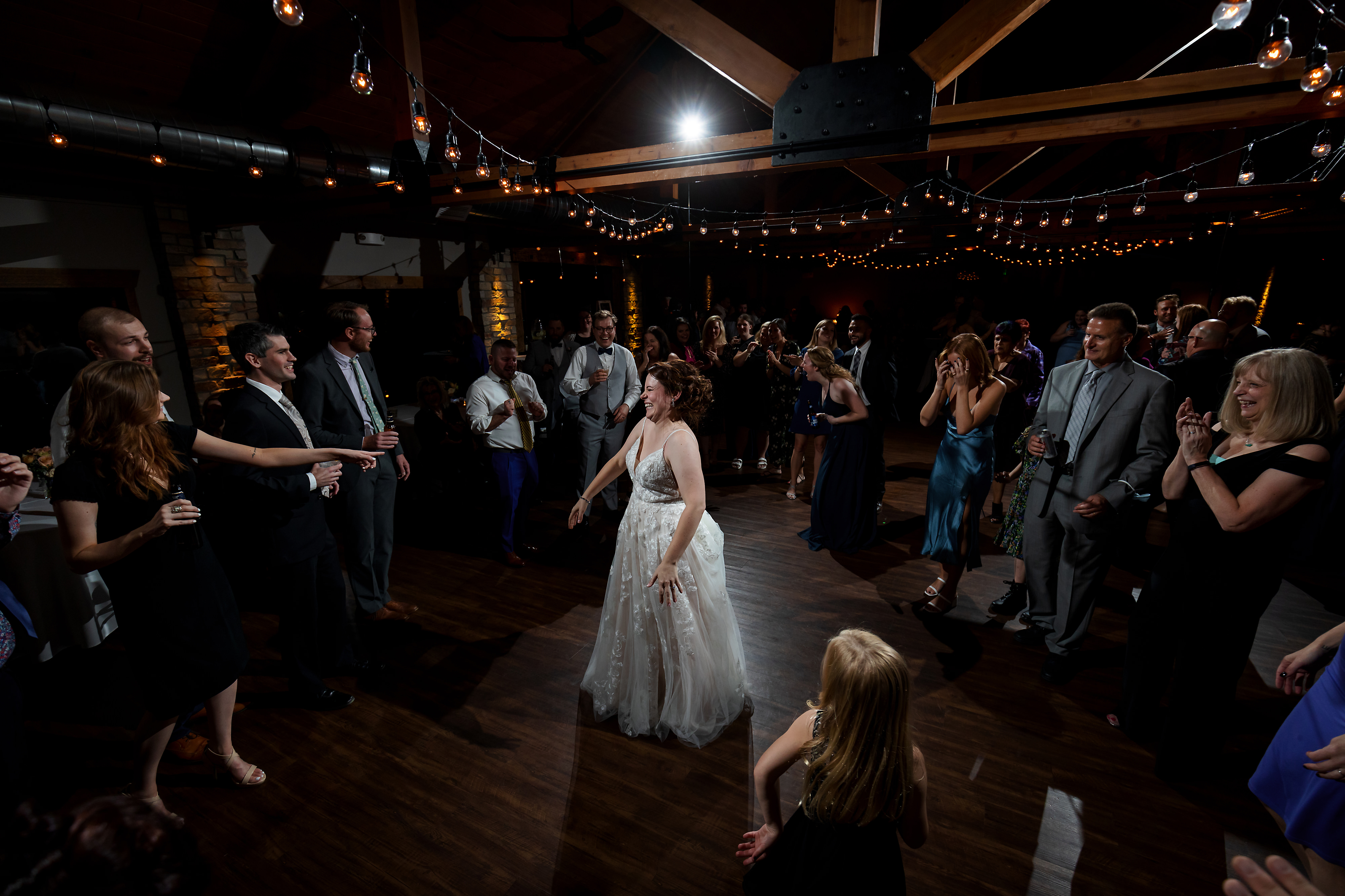 Wedding guests dance during wedding reception at Fishermen's Inn in Elburn Illinois
