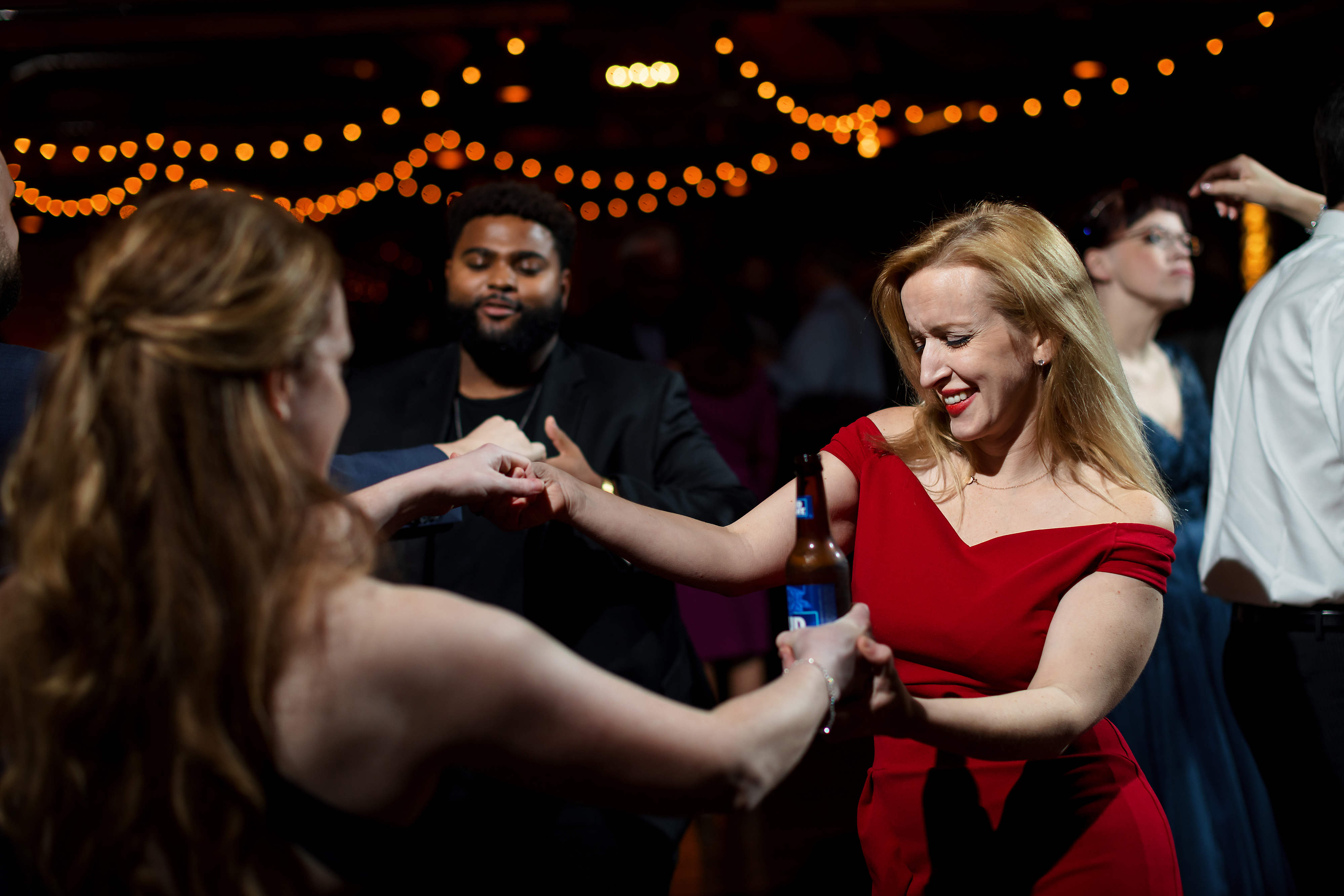 Wedding guests dance during wedding reception at Fishermen's Inn in Elburn Illinois