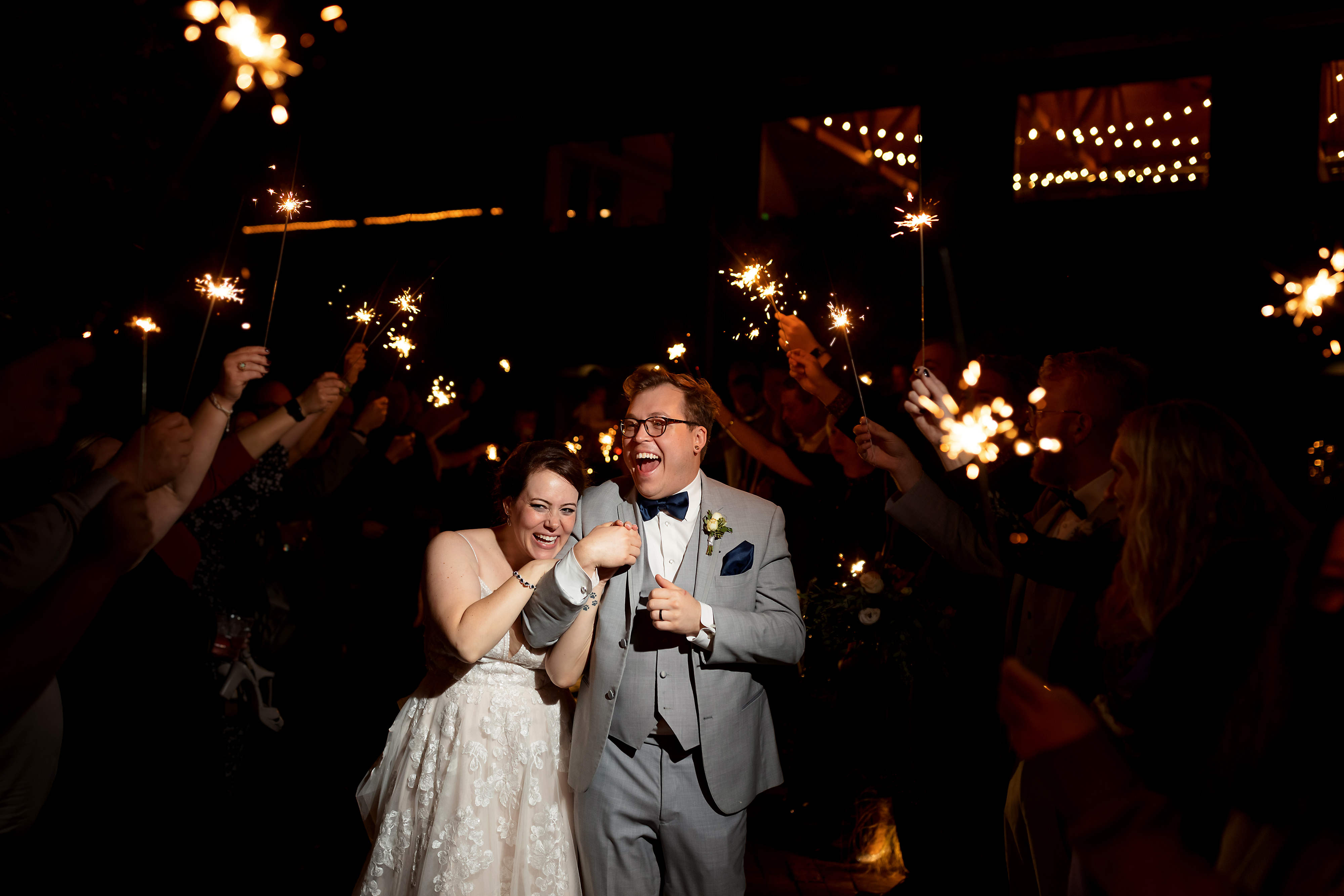 Bride and groom sparkler exit at the end of wedding reception at Fishermen's Inn in Elburn Illinois