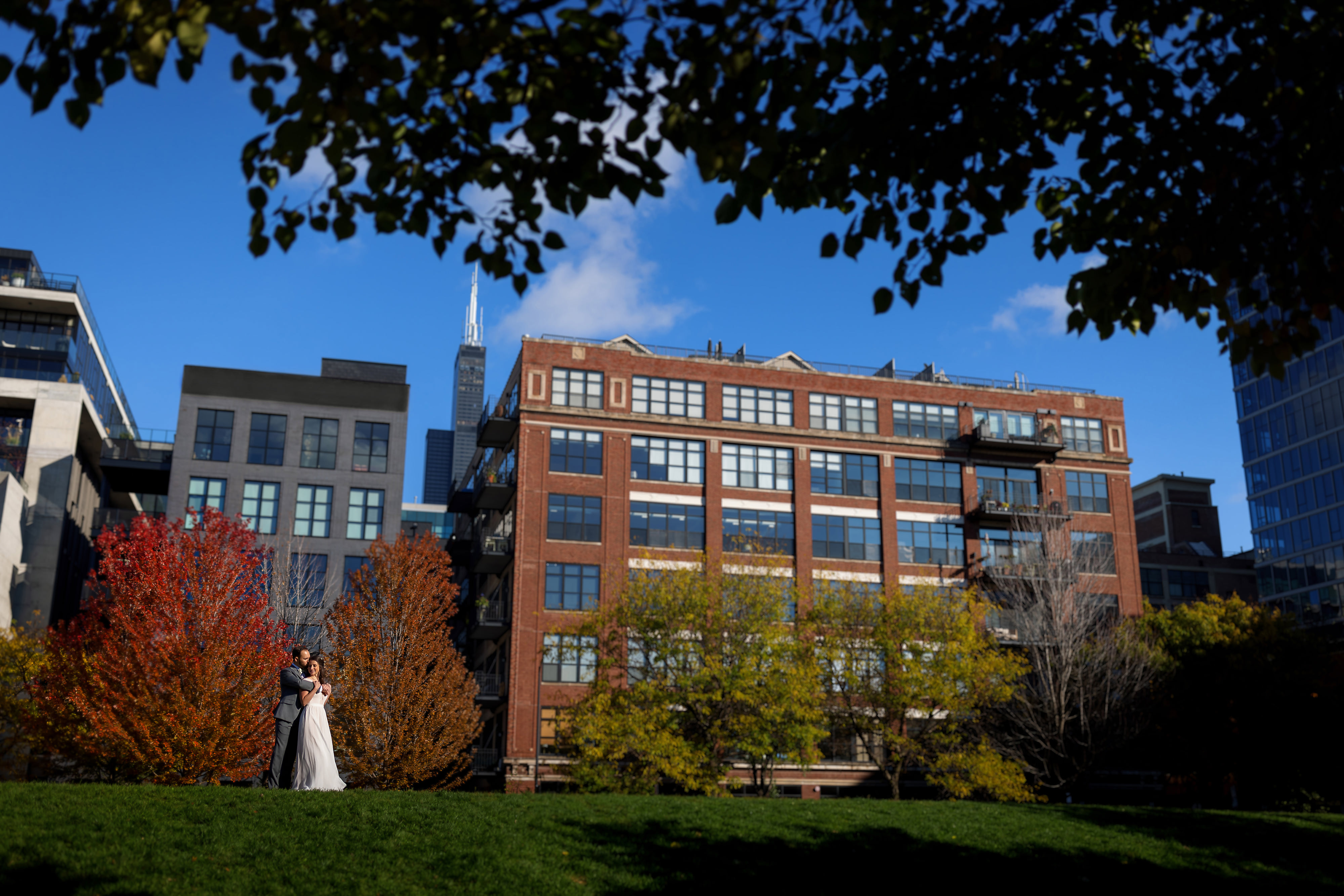 Bride and groom pose for wedding portrait at Mary Bartelme Park in Chicago's West Loop neighborhood.