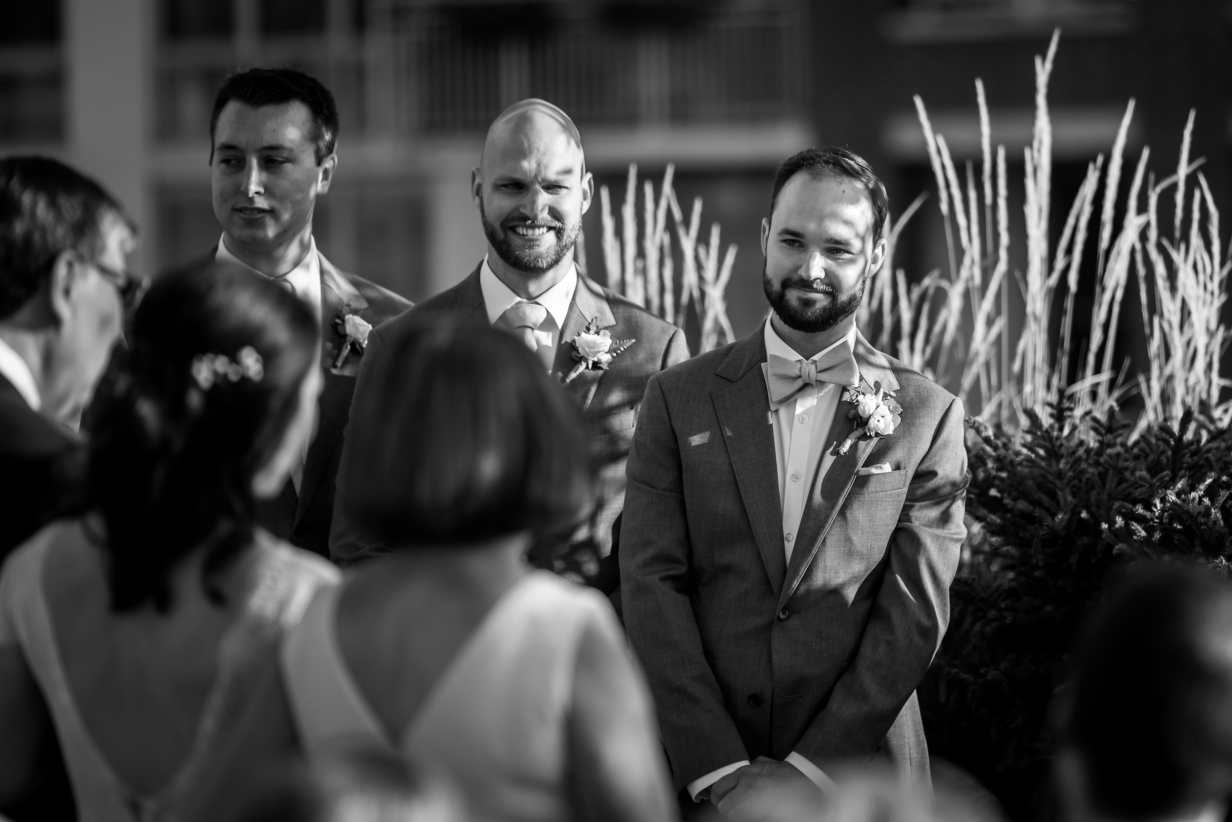 Groom reacts to seeing bride walk down the aisle during wedding ceremony at Loft Lucia in Chicago's West Loop neighborhood.