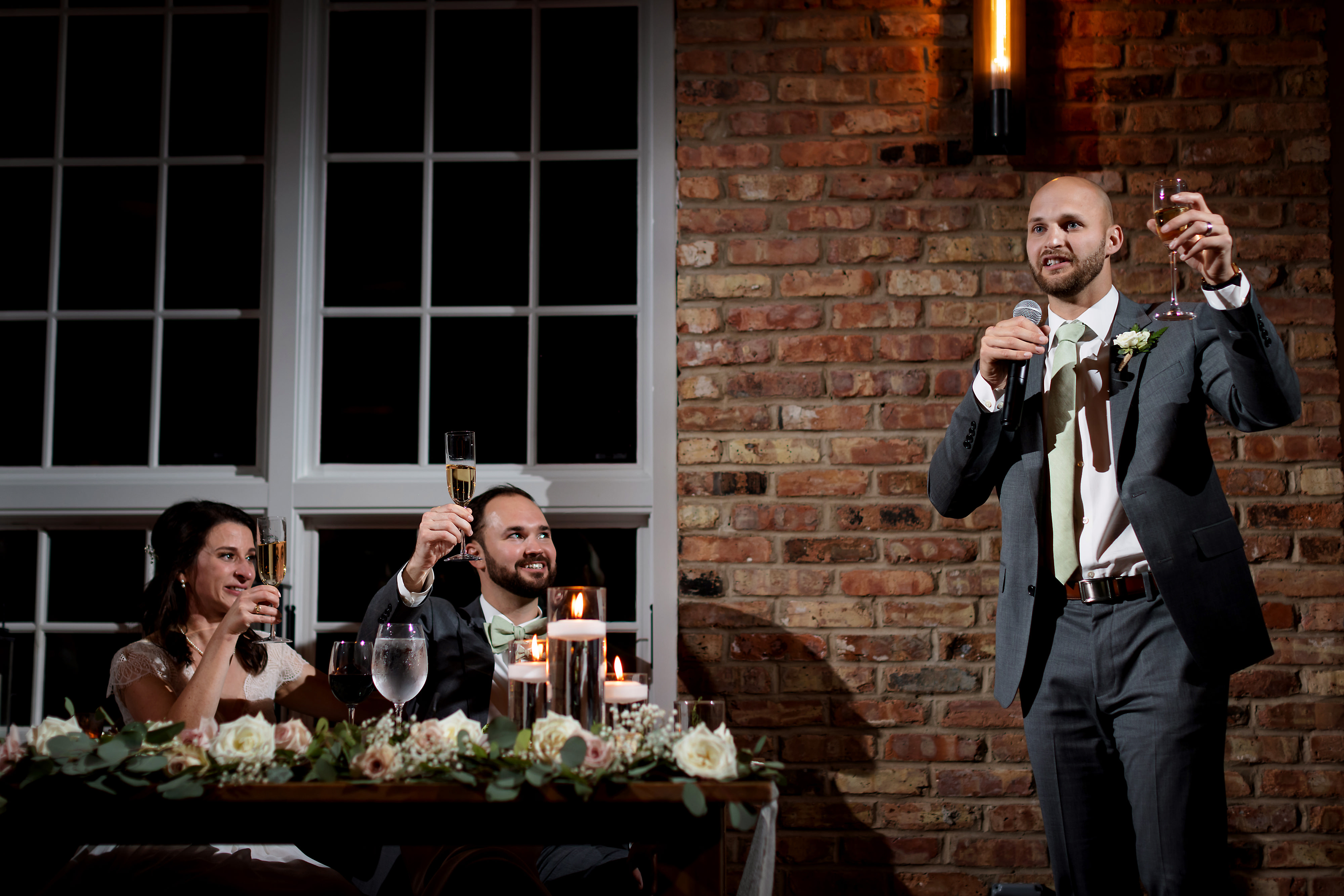 Toasts during wedding reception at Loft Lucia in Chicago's West Loop neighborhood.