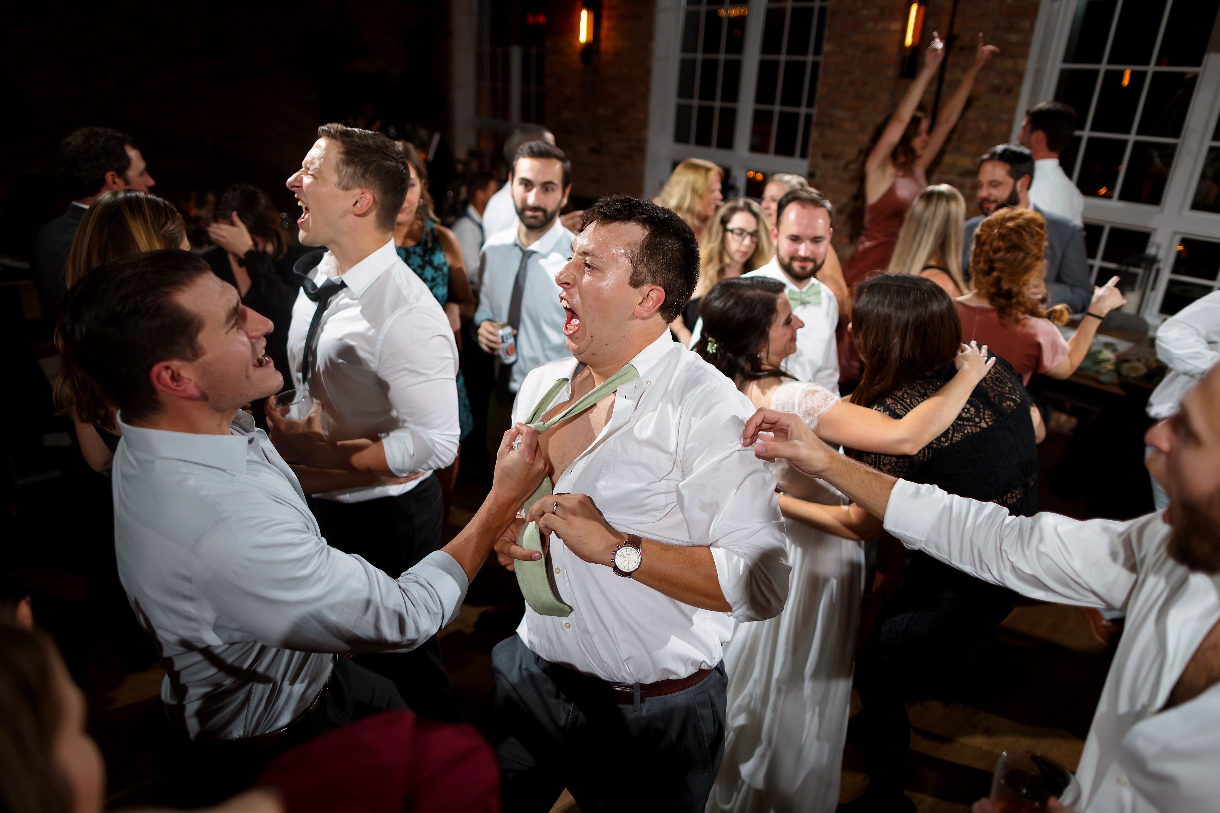 Wedding guests dance during reception at Loft Lucia in Chicago's West Loop neighborhood.