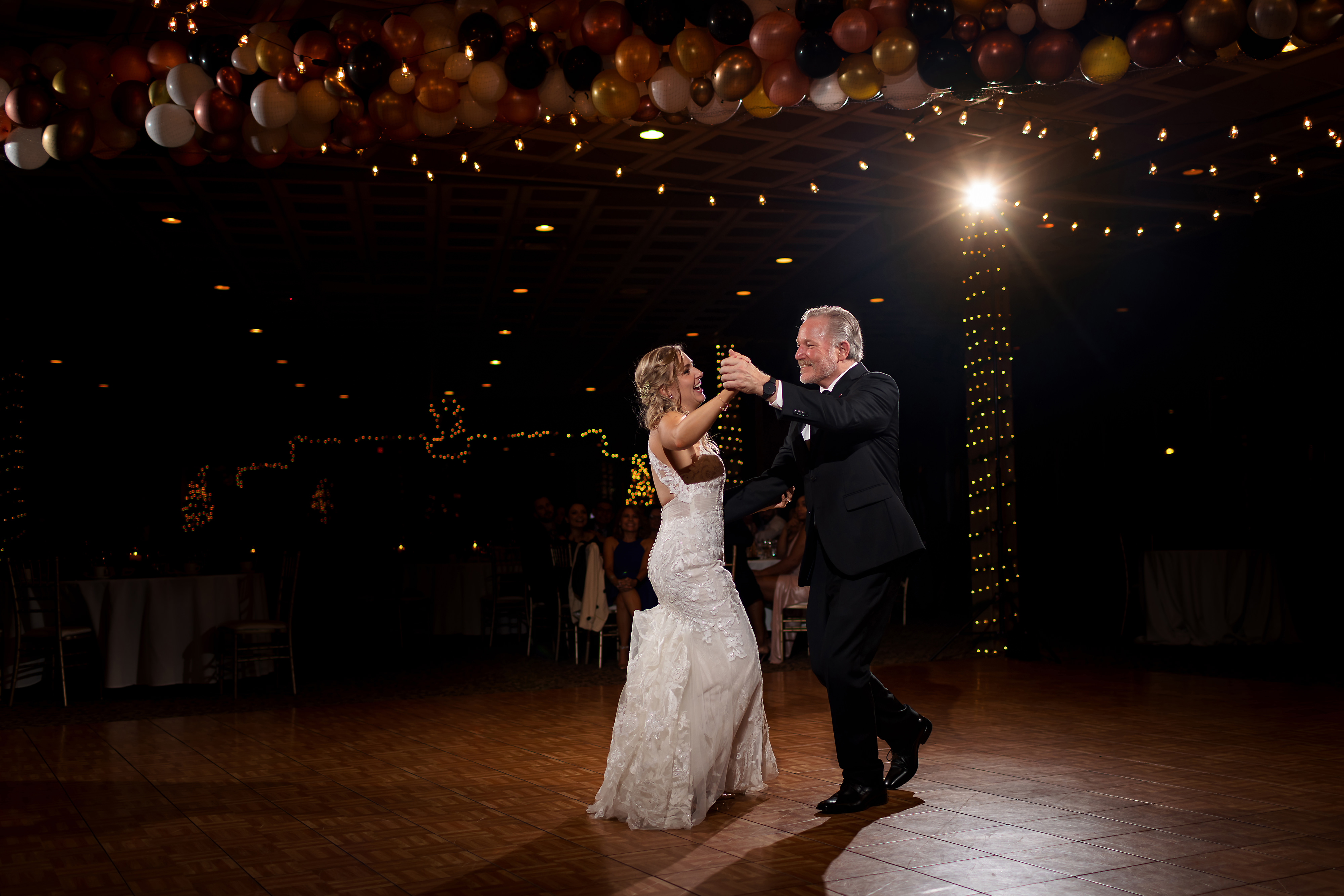 Bride dances with dad during wedding reception at Two Brothers Brewery in Aurora, Illinois