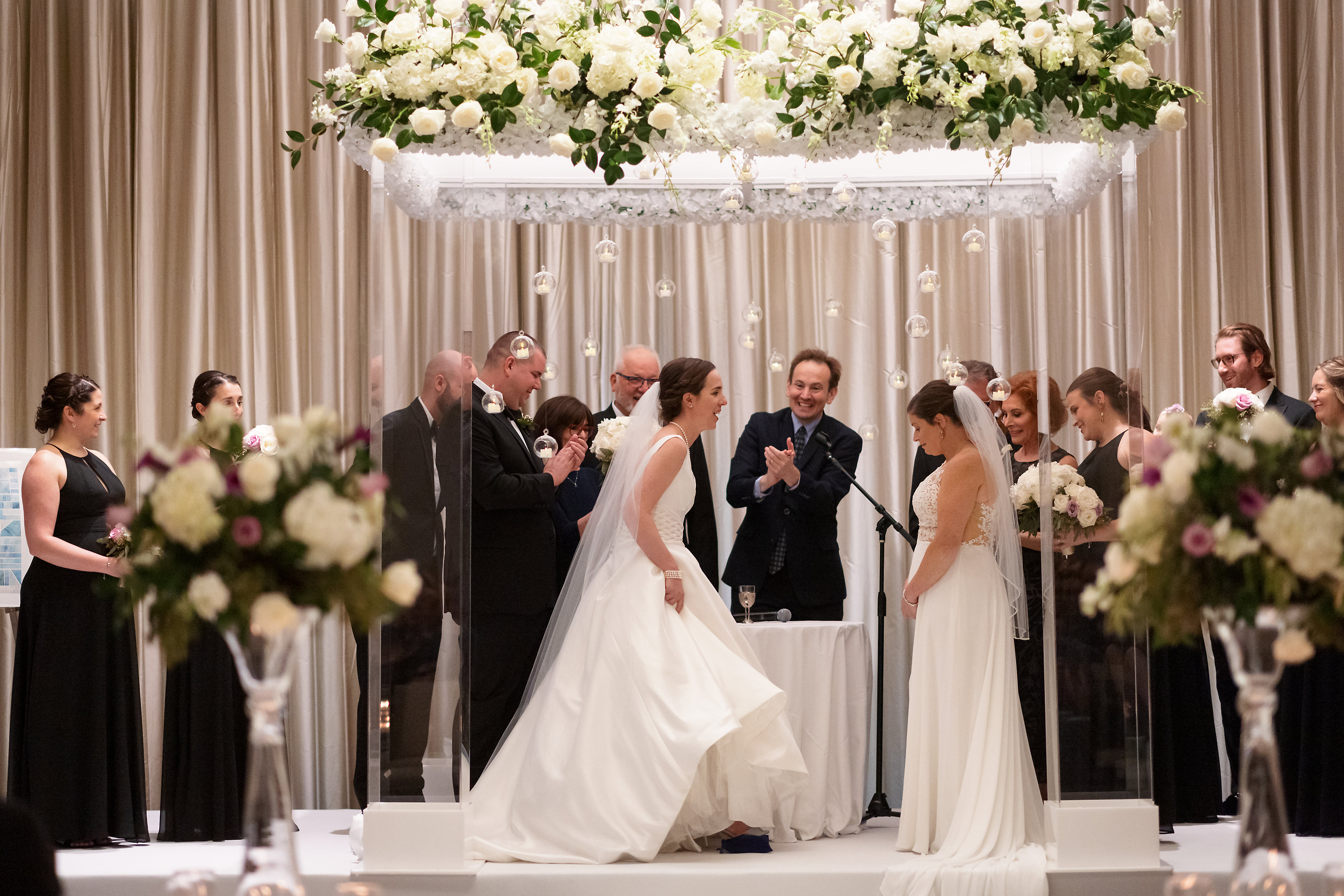 Brides break glass during wedding ceremony at The Langham Hotel in downtown Chicago