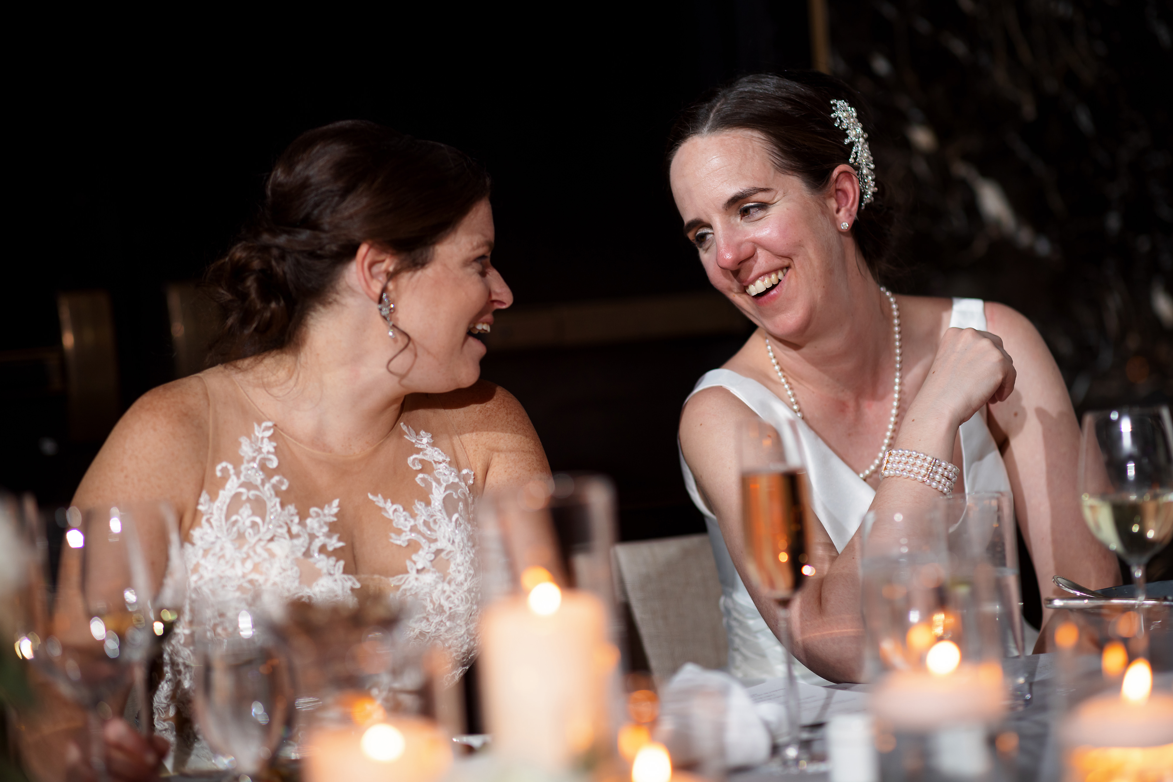 brides laugh during toasts at The Langham Hotel in downtown Chicago