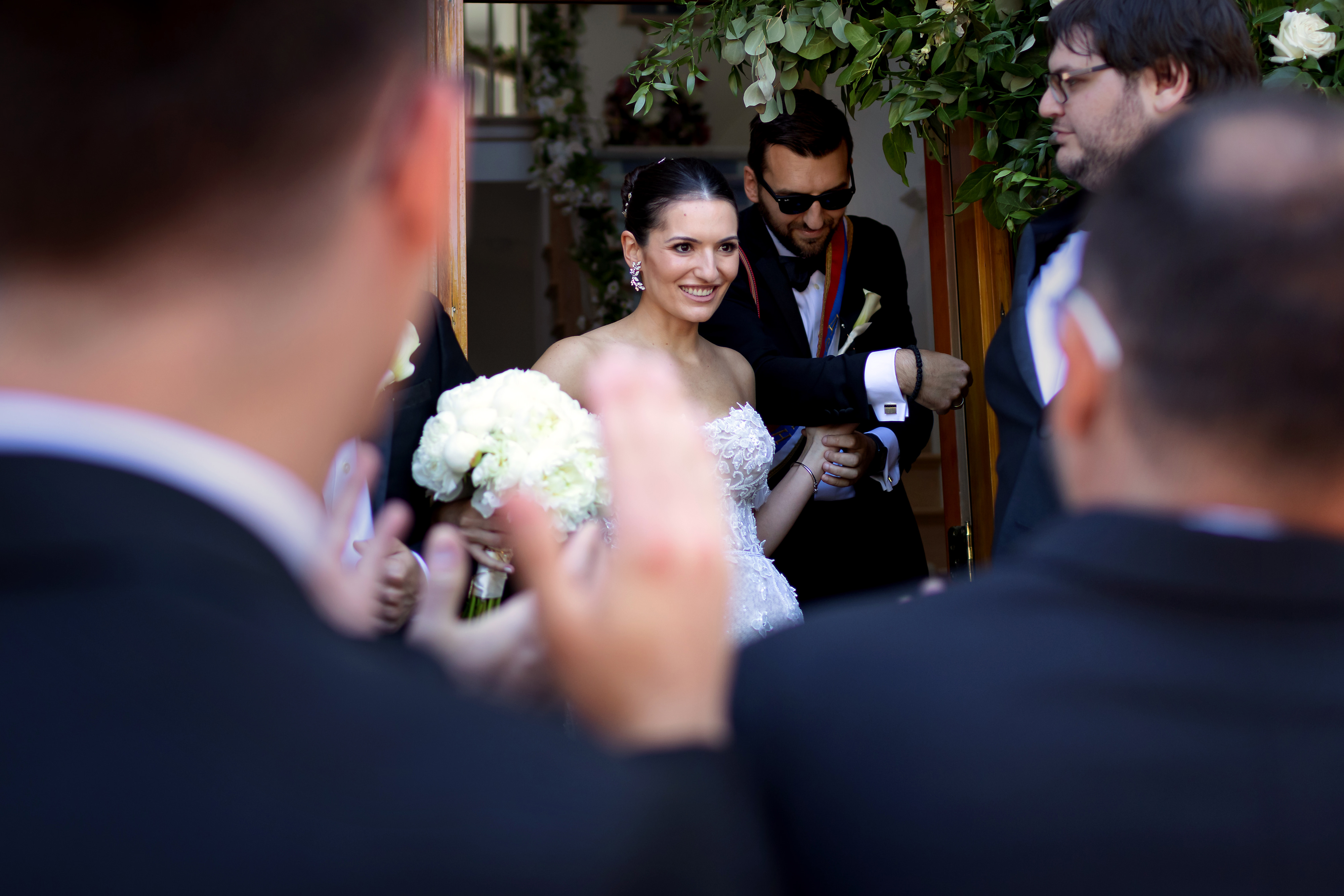 Bride appears at doorway during Serbian Orthodox Wedding Skup